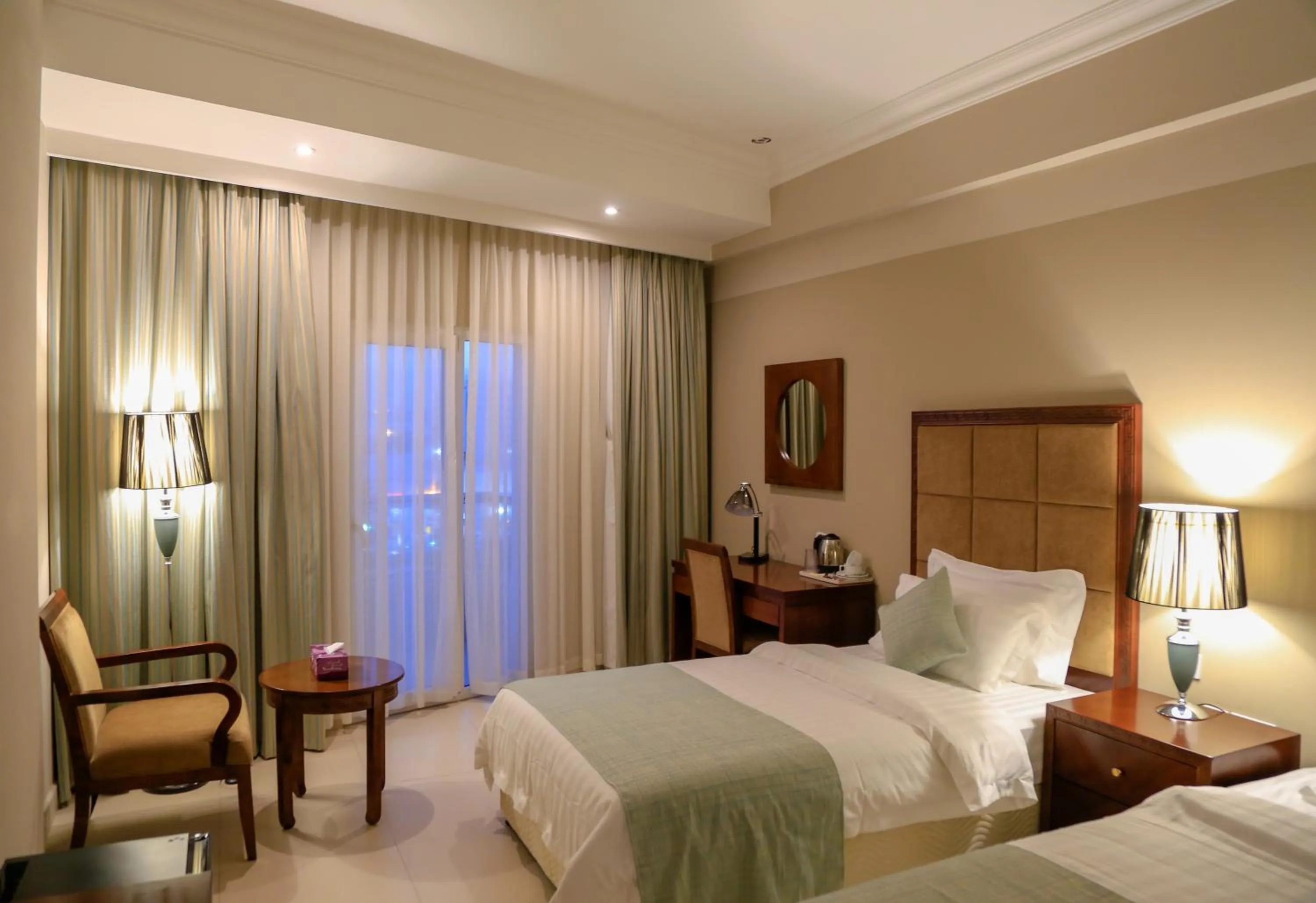 Photo of the whole room, Bed in Muscat Inn Hotel