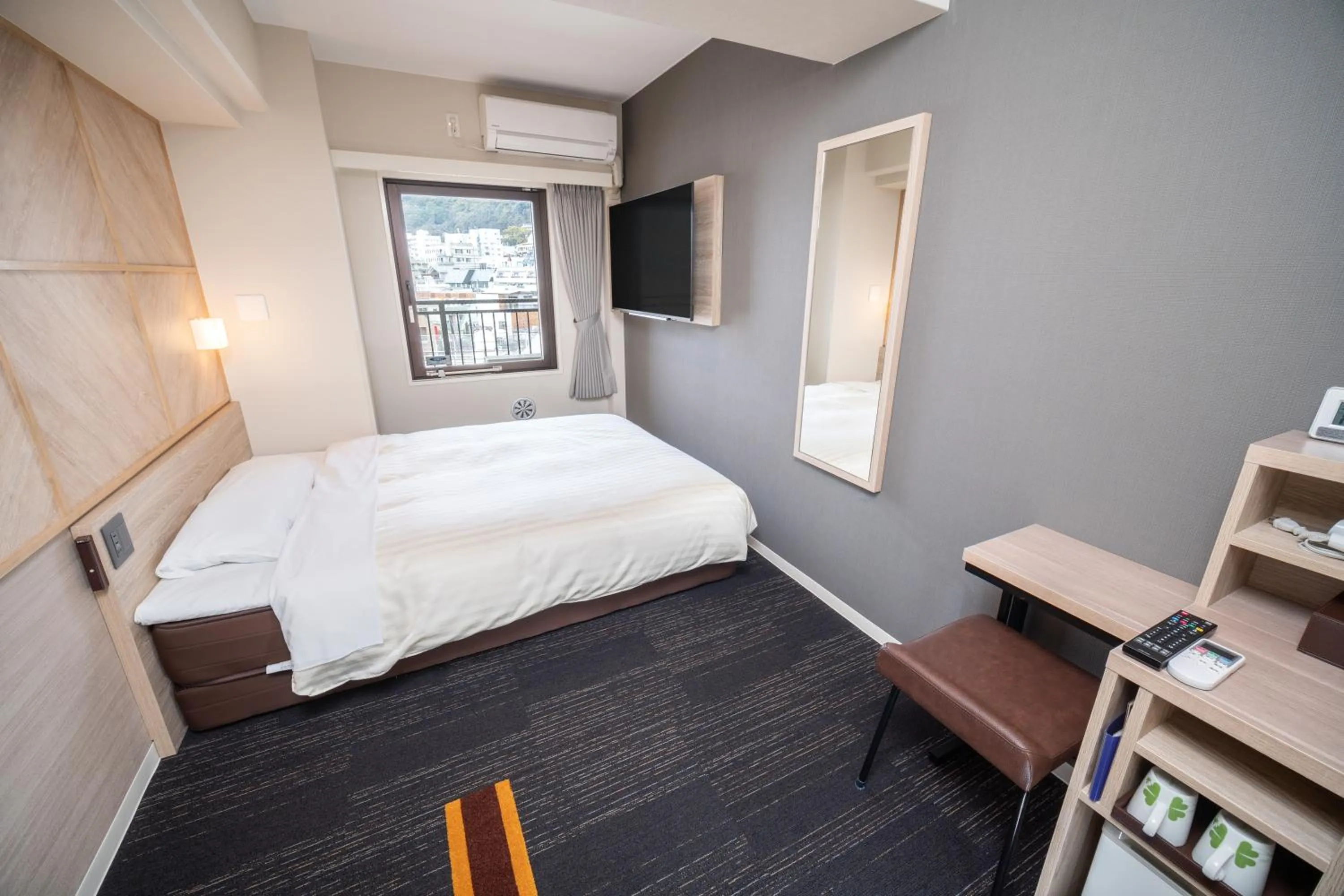 Bed in Super Hotel Kobe