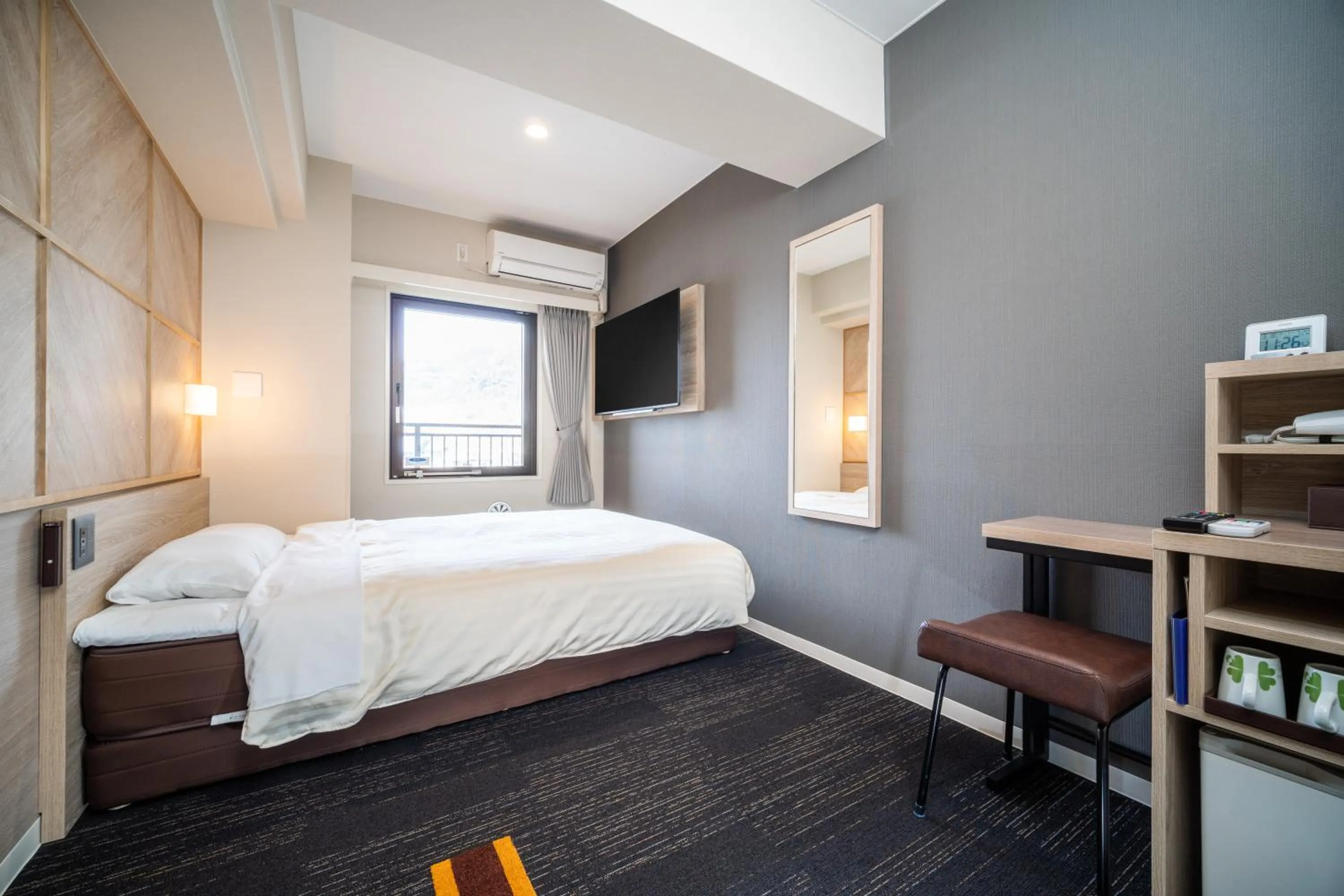 Bed in Super Hotel Kobe