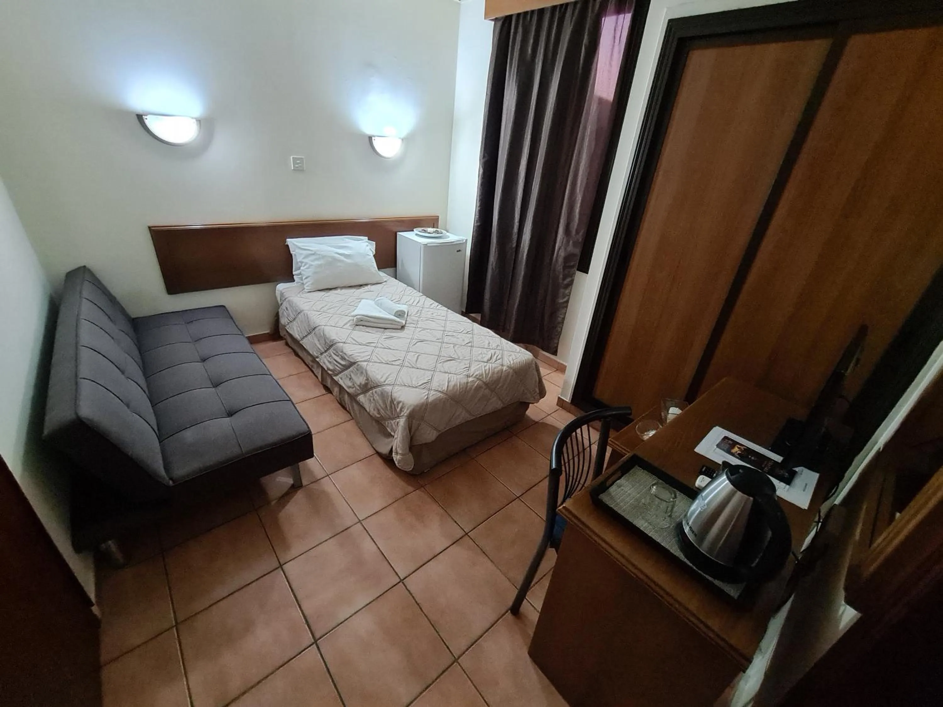 Bed in Metropole Hotel