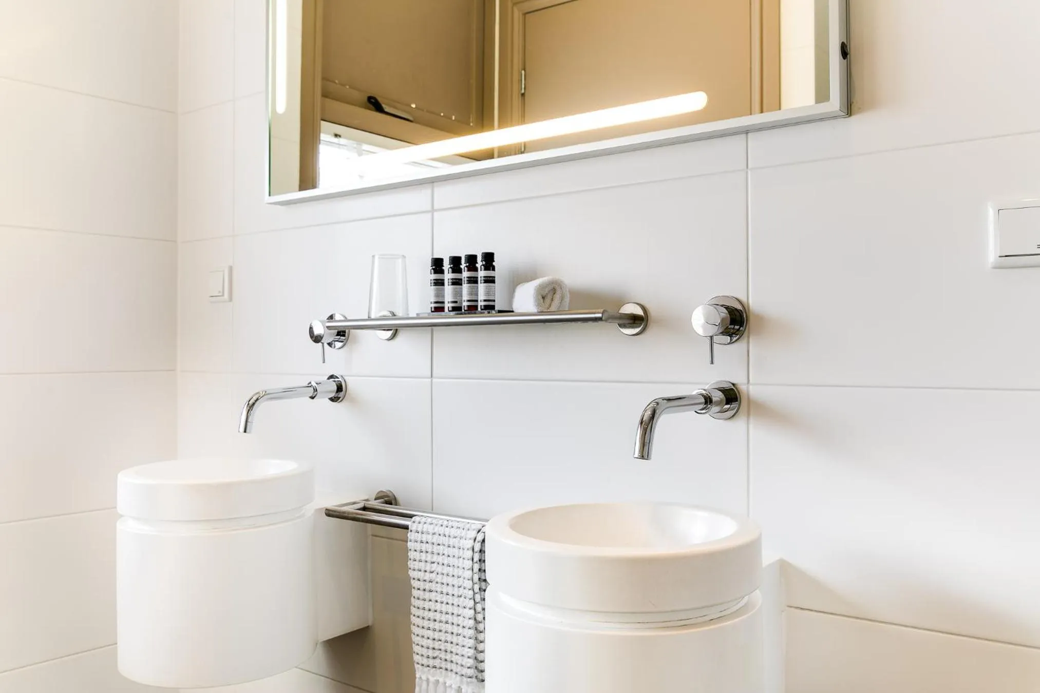 Bathroom in Brasss Hotel Suites