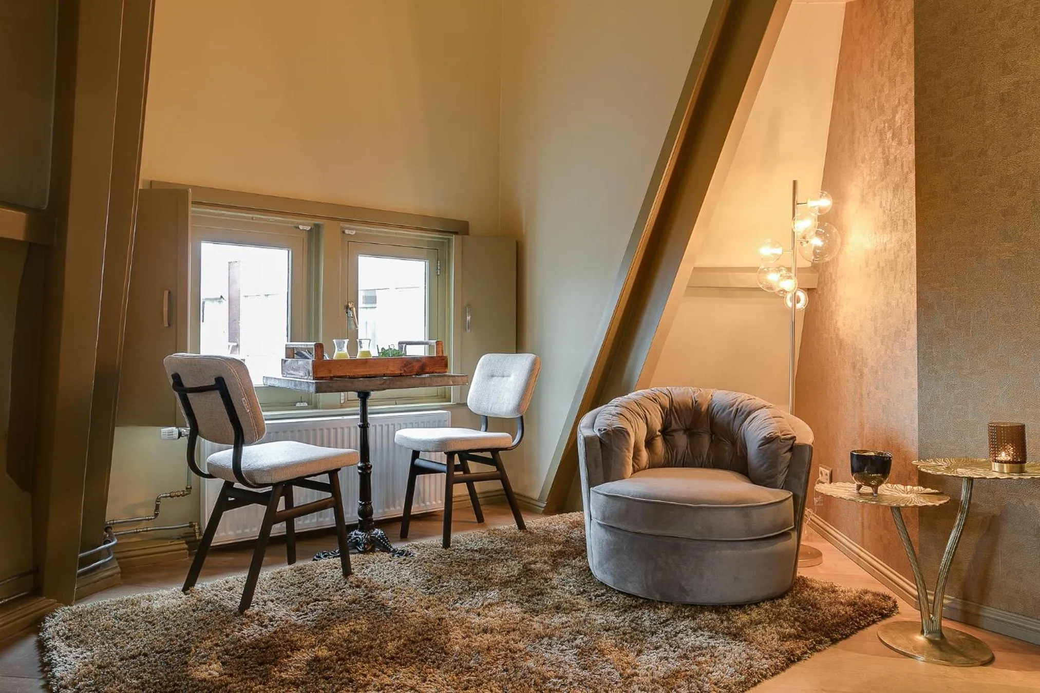 Seating area in Brasss Hotel Suites