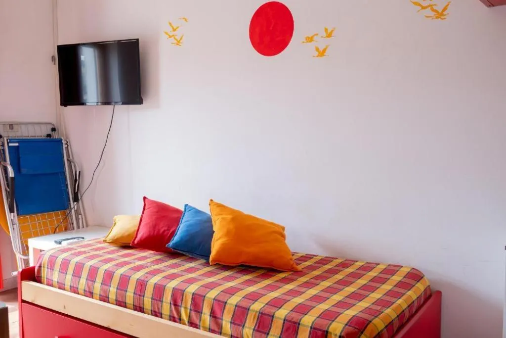 Living room, Bed in Residence La Giungla