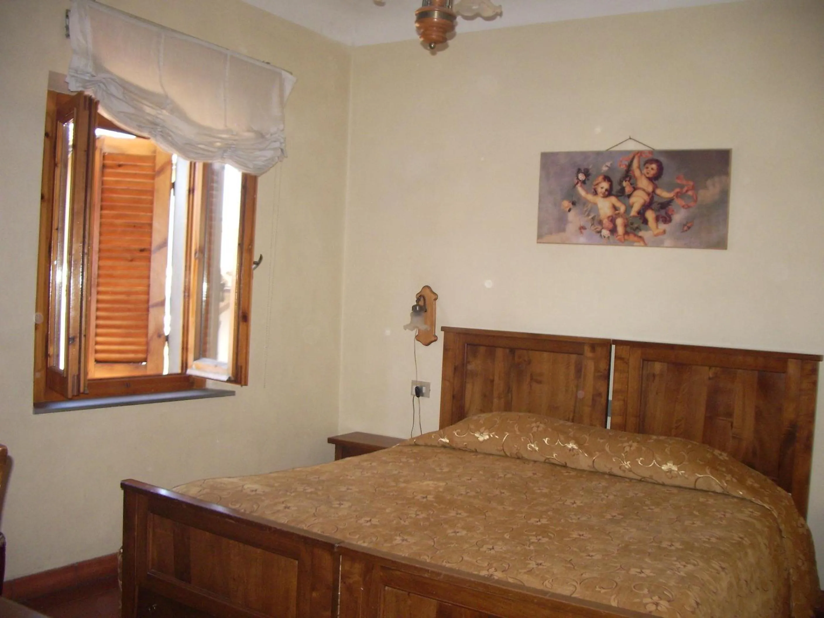 Bed in Albergo Villa Sorriso