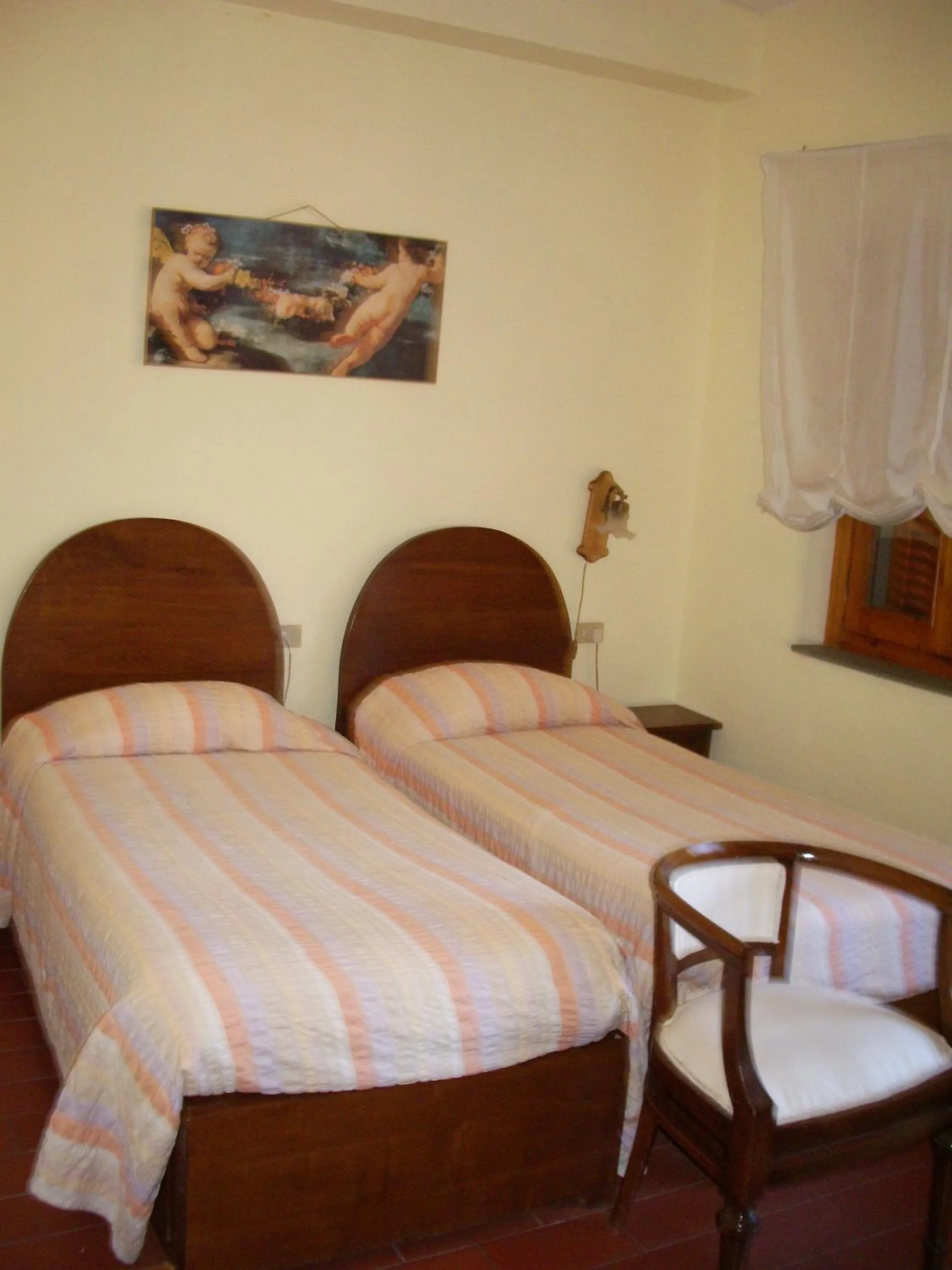 Bed in Albergo Villa Sorriso