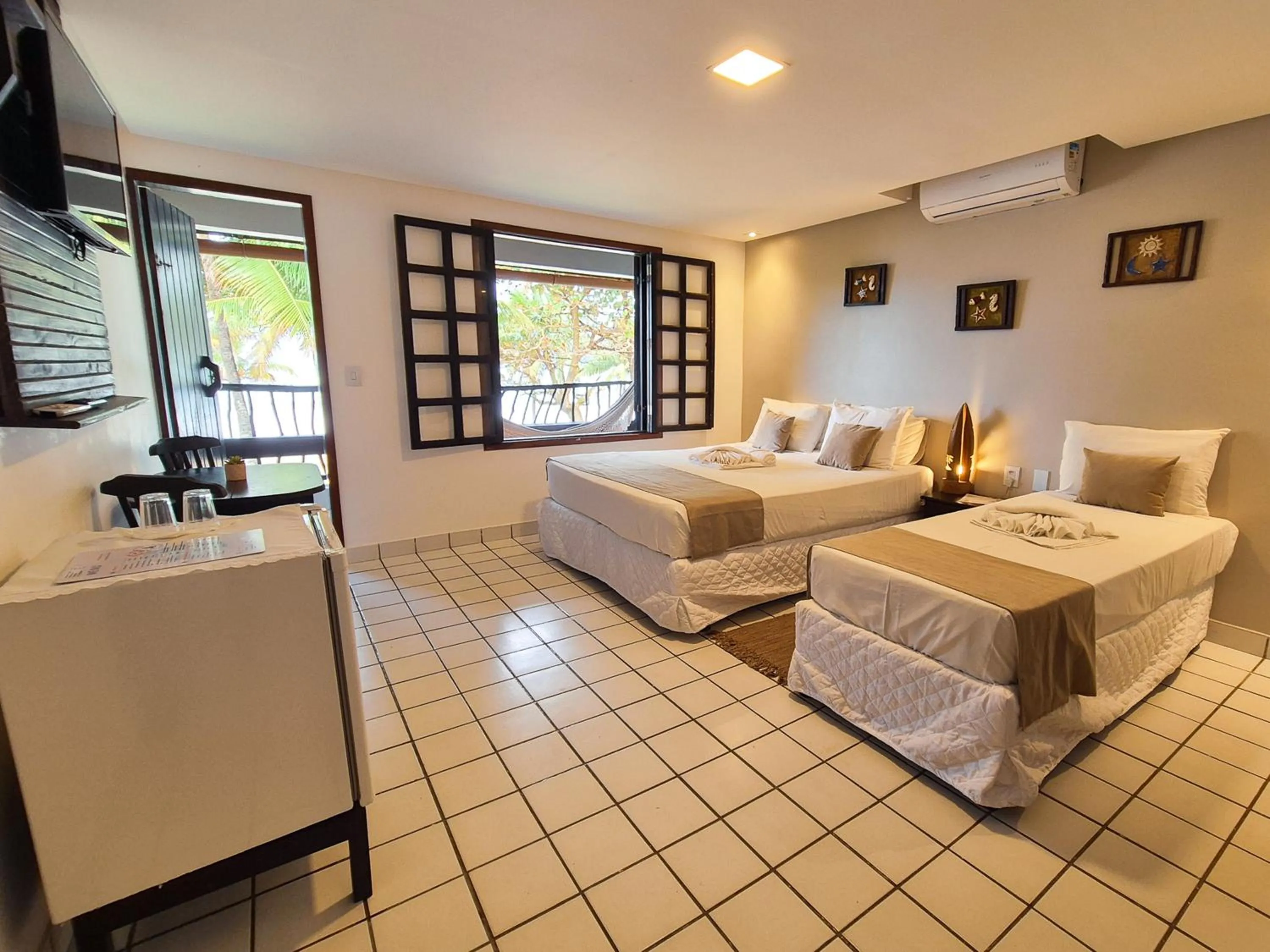 Bed in Pousada dos Coqueiros