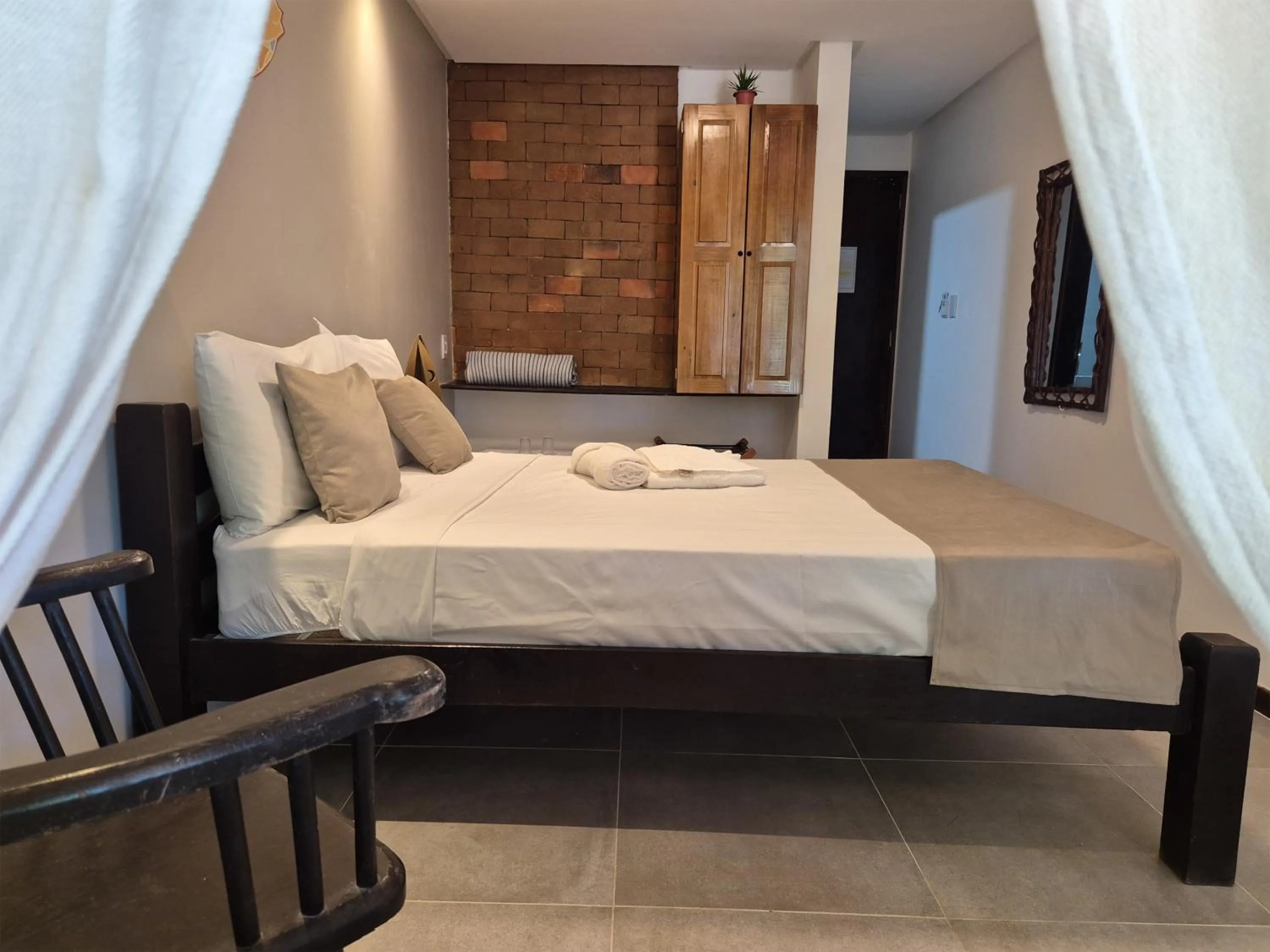 Bed in Pousada dos Coqueiros