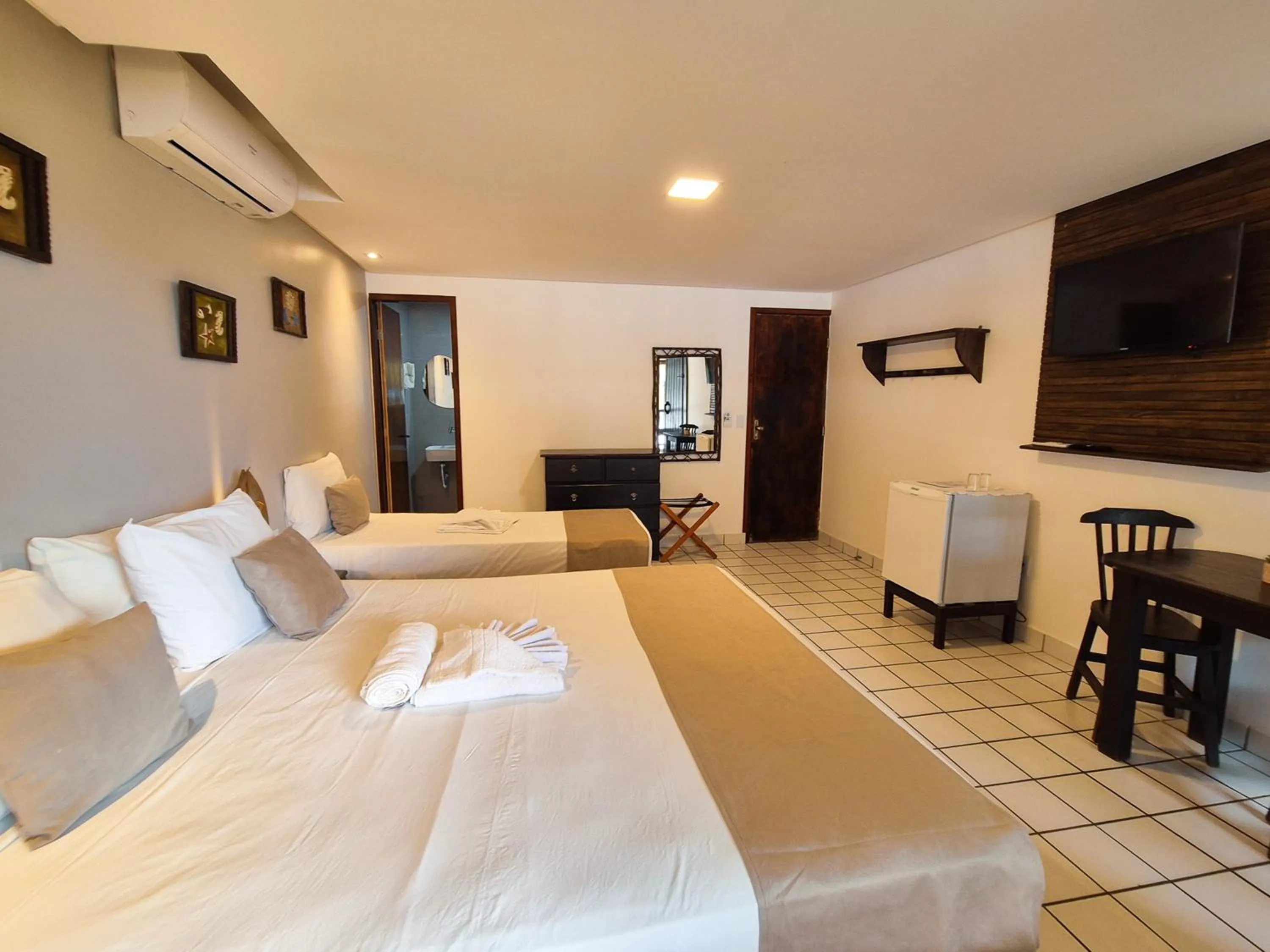 Bed in Pousada dos Coqueiros