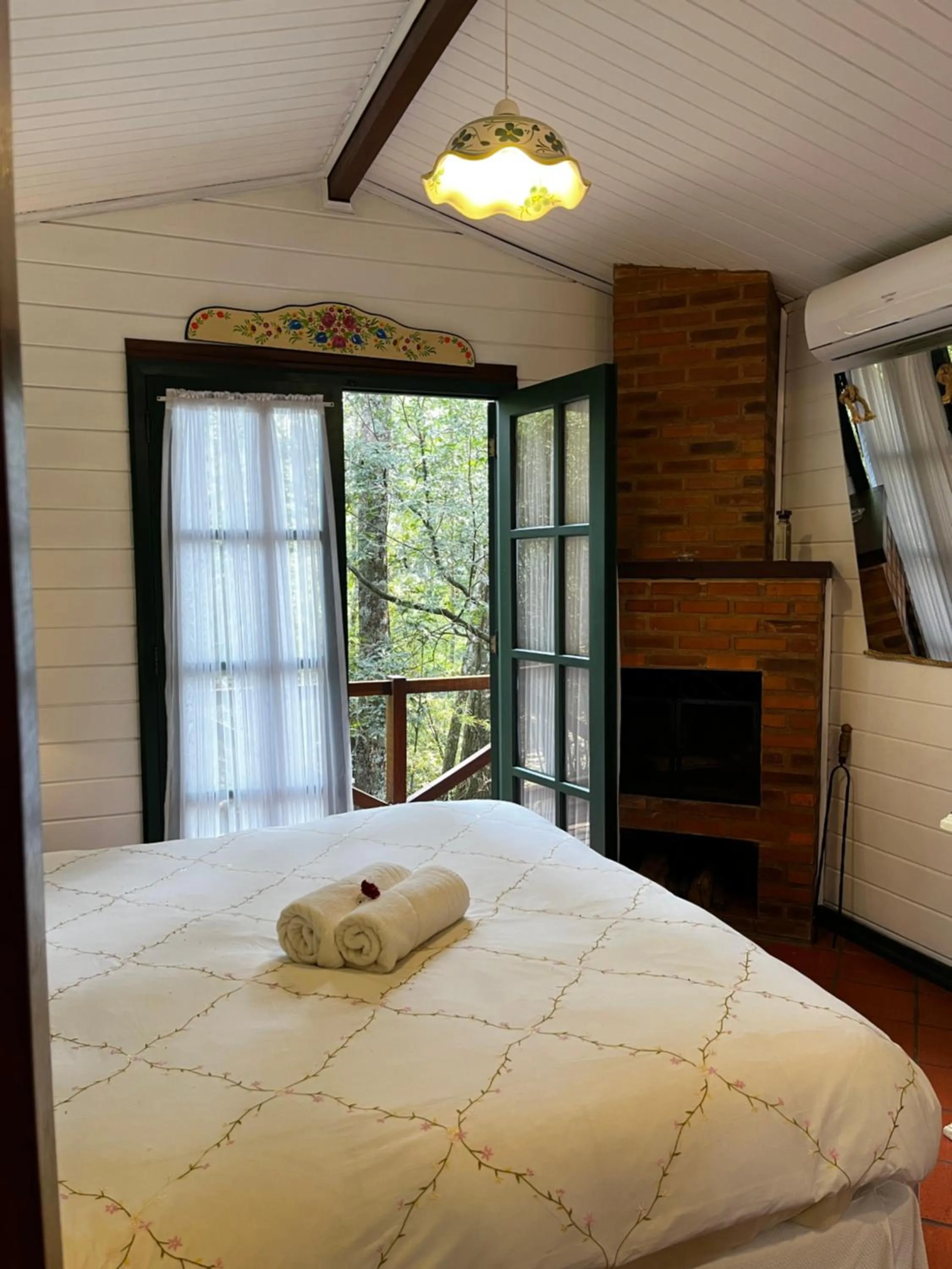 fireplace, Bed in Urikana Boutique Hotel