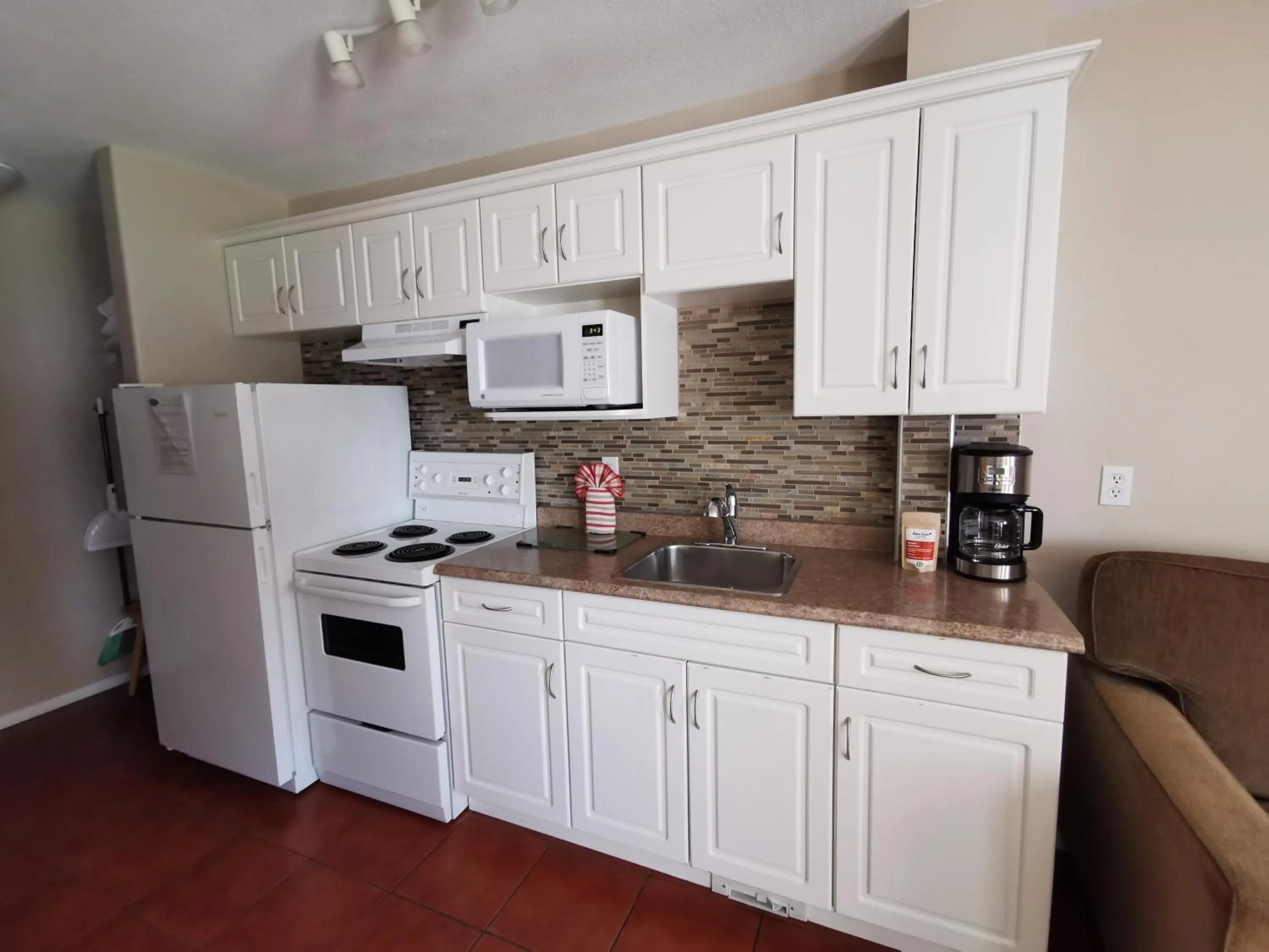 Kitchen or kitchenette in Sandy Beach Suites