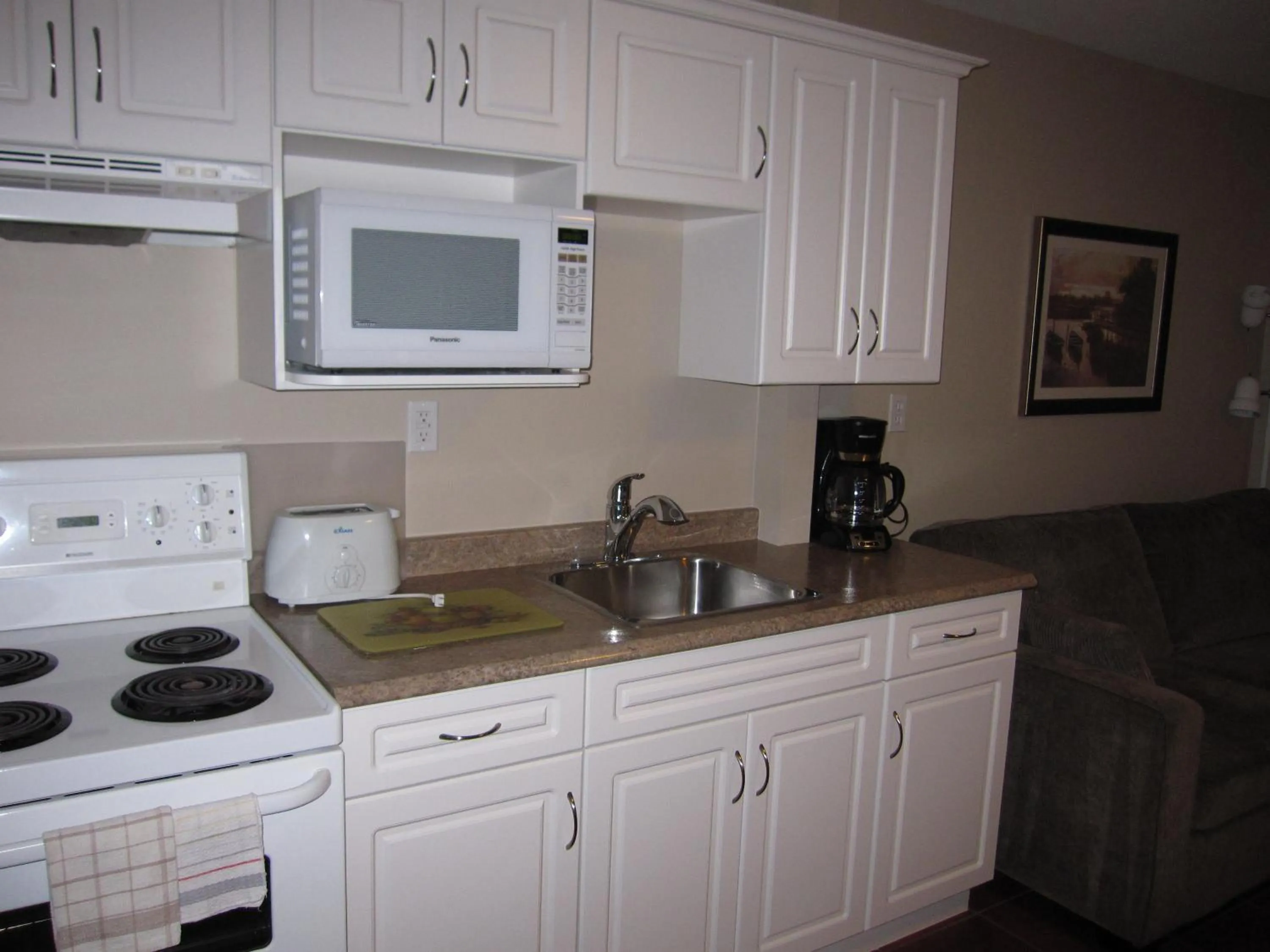 Kitchen or kitchenette in Sandy Beach Suites