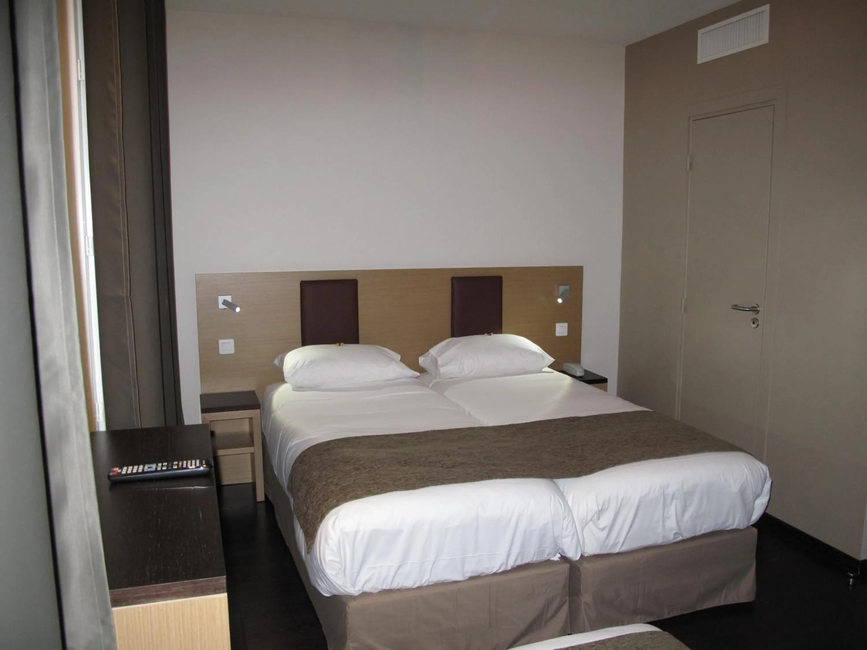 Bed in Source Hôtel