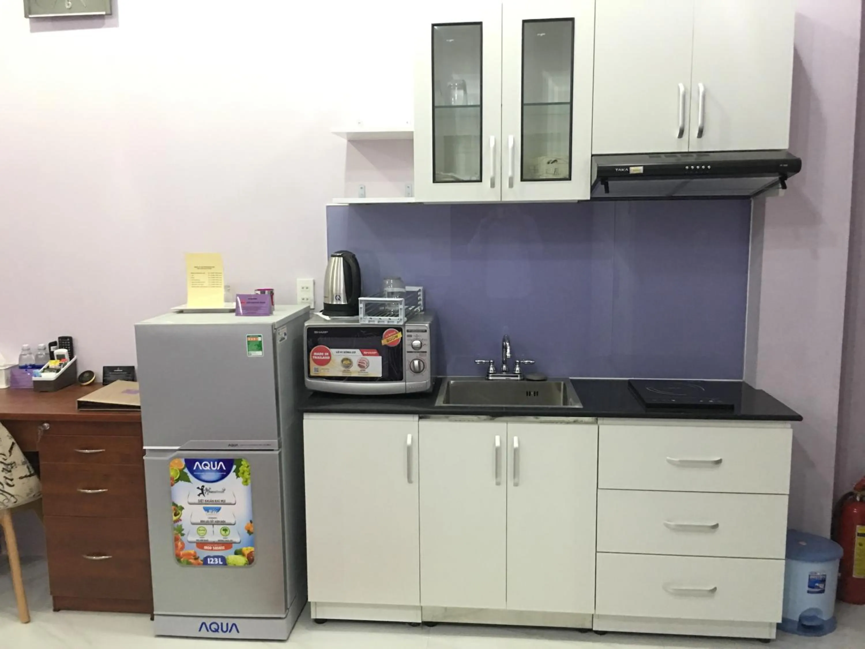 Kitchen or kitchenette in HT Hotel Apartment