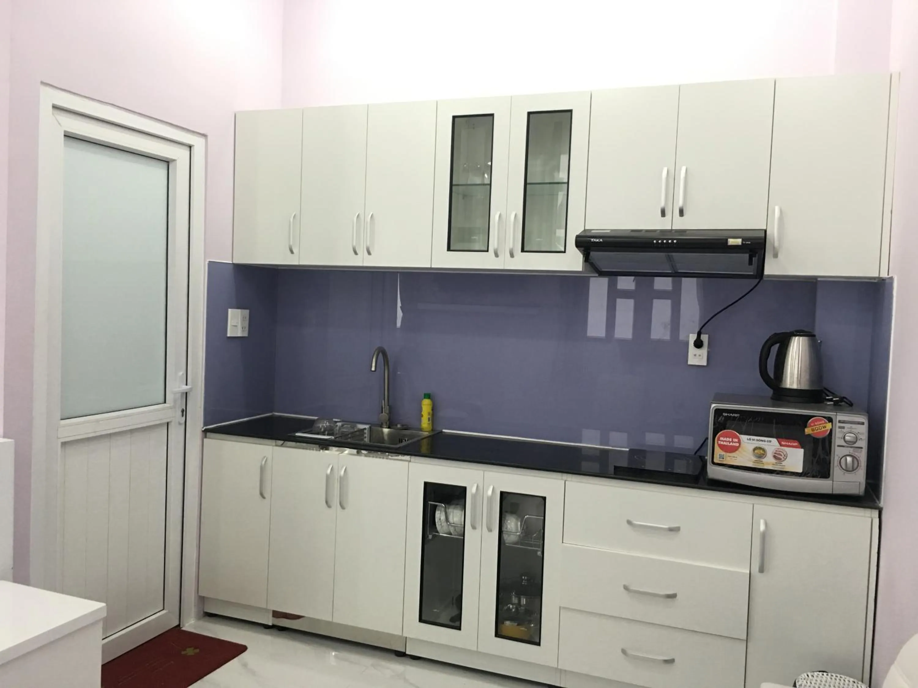 Kitchen or kitchenette in HT Hotel Apartment