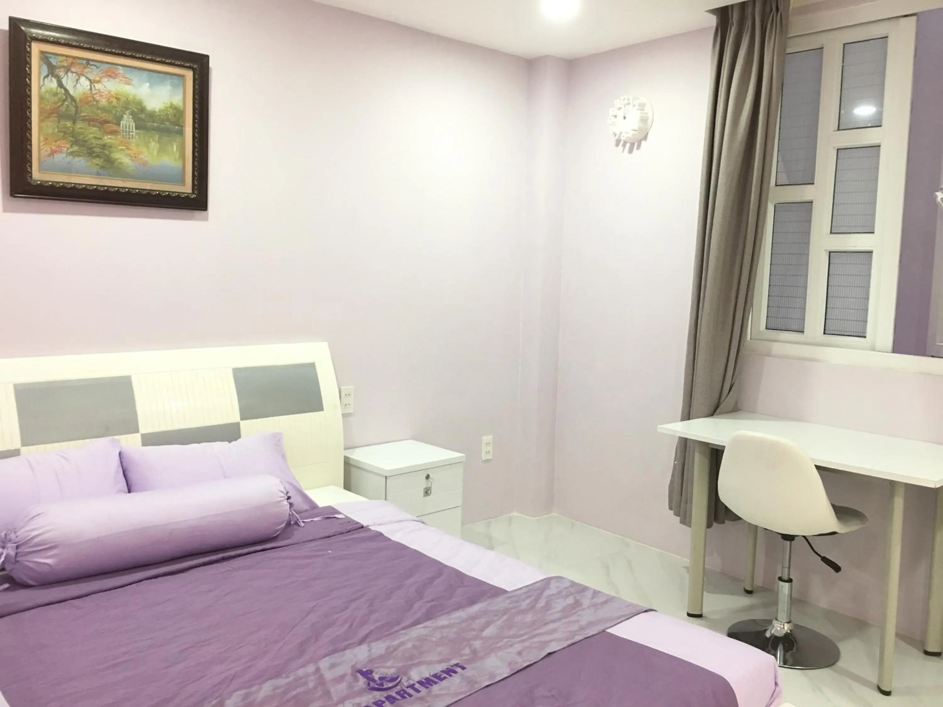 Bed in HT Hotel Apartment