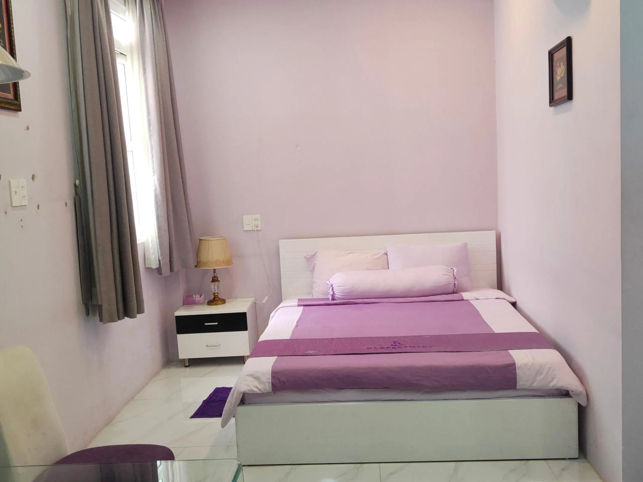 Bed in HT Hotel Apartment