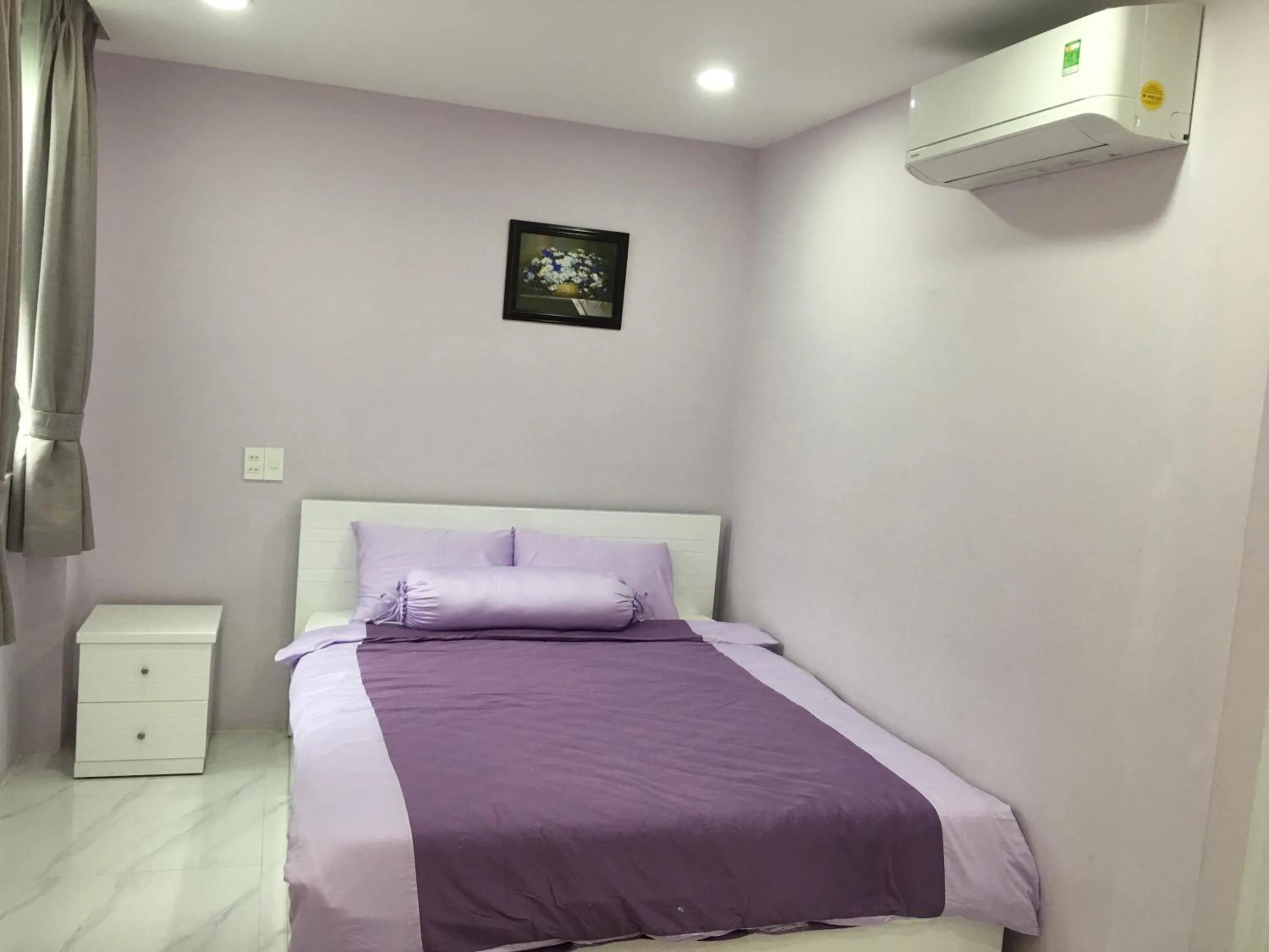 Bed in HT Hotel Apartment