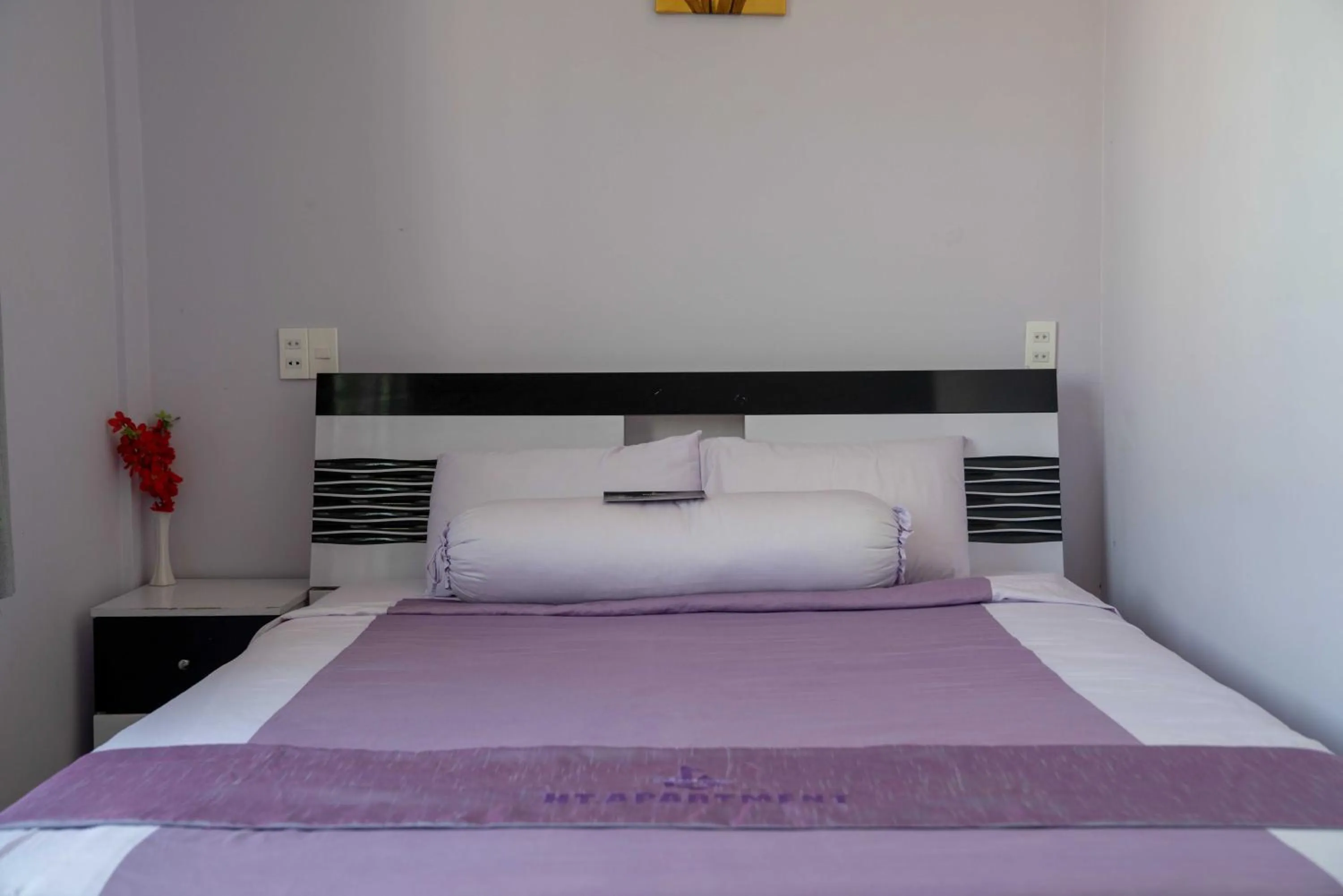 Bed in HT Hotel Apartment