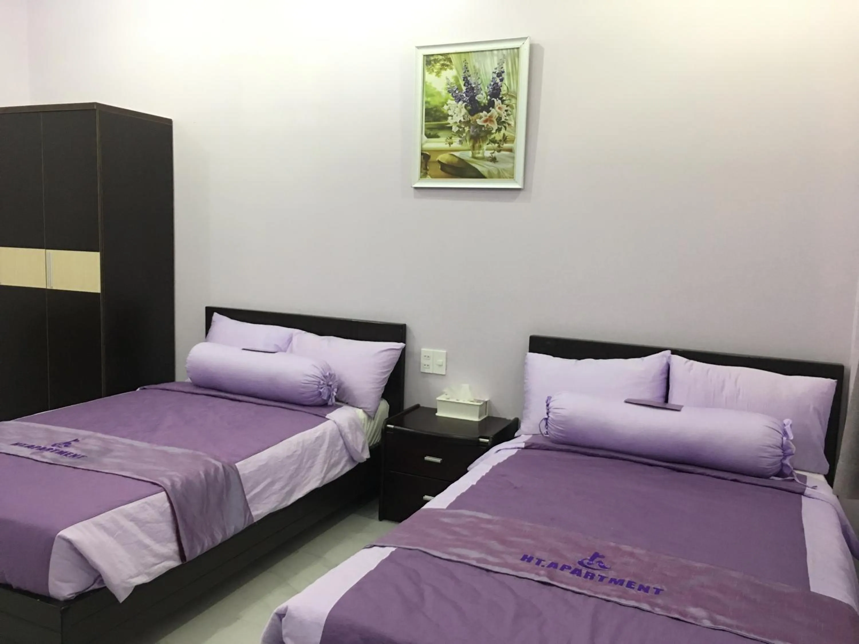 Bed in HT Hotel Apartment