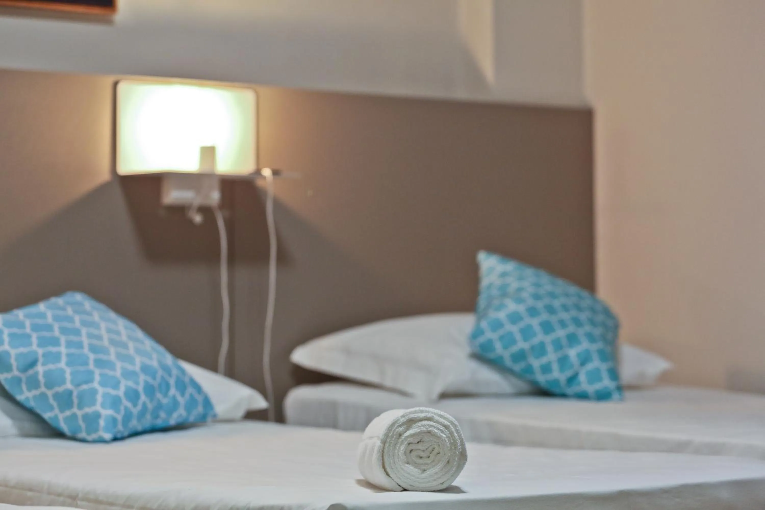 Bed in Sandri City Hotel