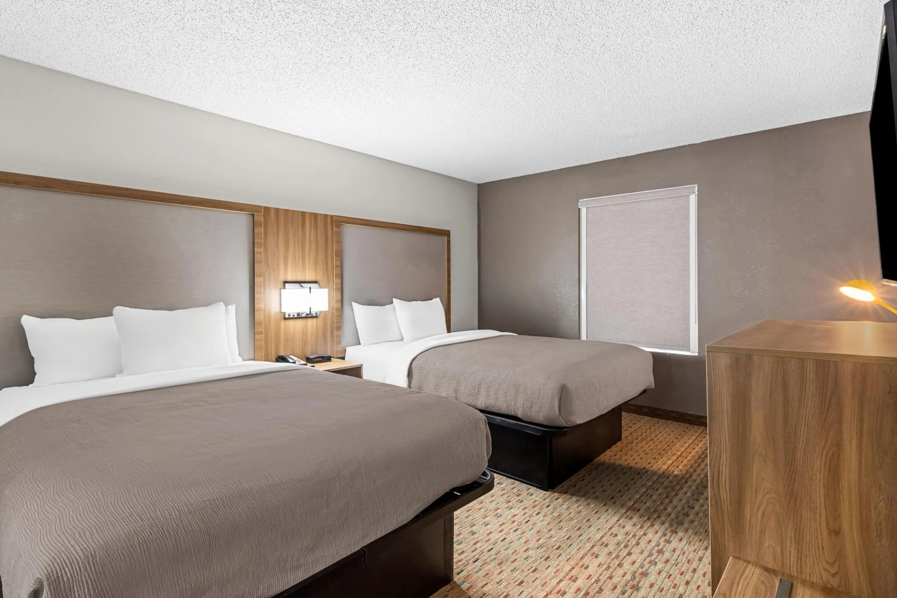 Bed in Quality Inn Cornelia