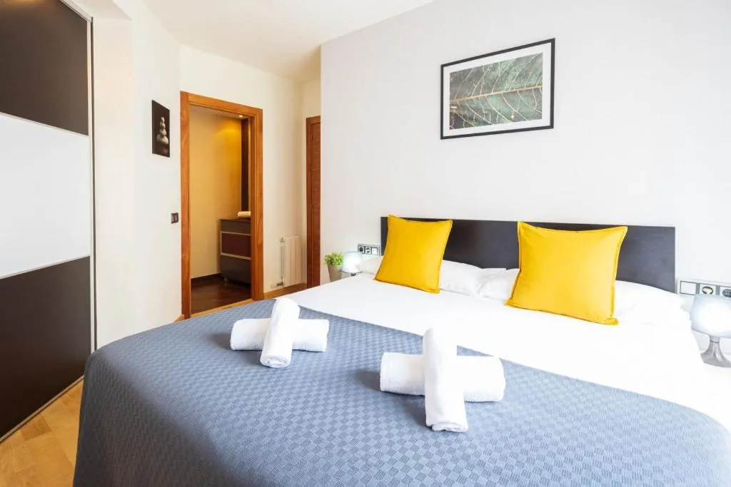 Bed in Lucas House Apartments by Sitges Group