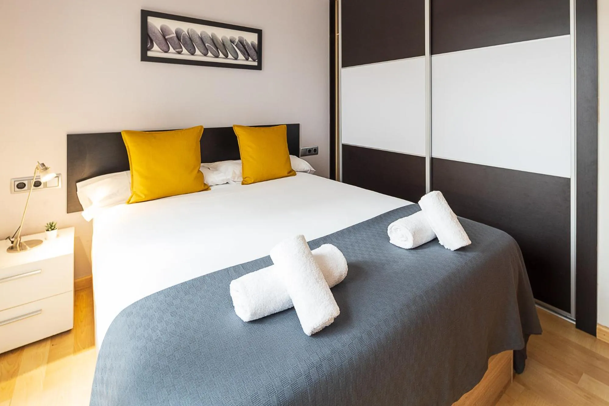 Bed in Lucas House Apartments by Sitges Group