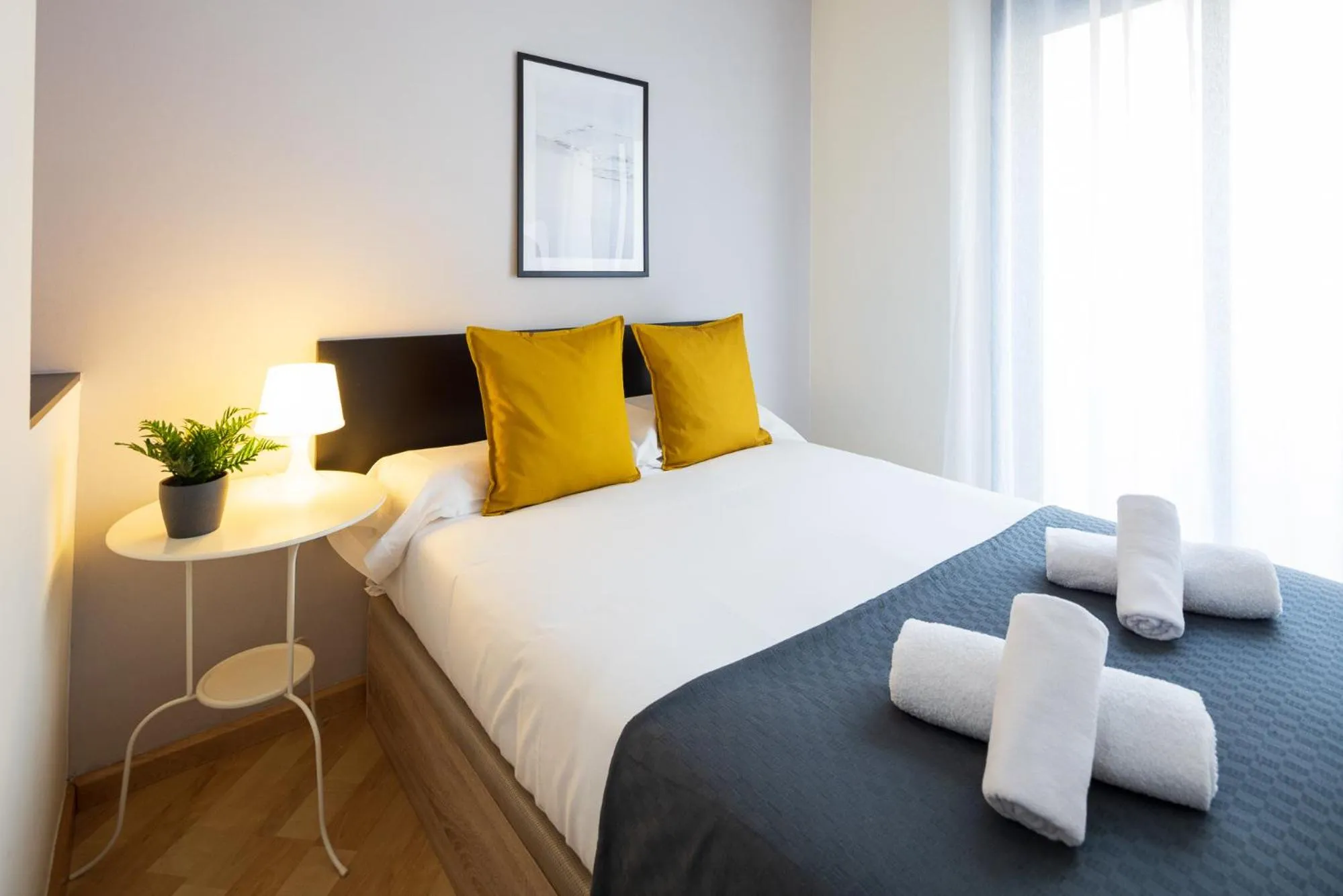 Bed in Lucas House Apartments by Sitges Group