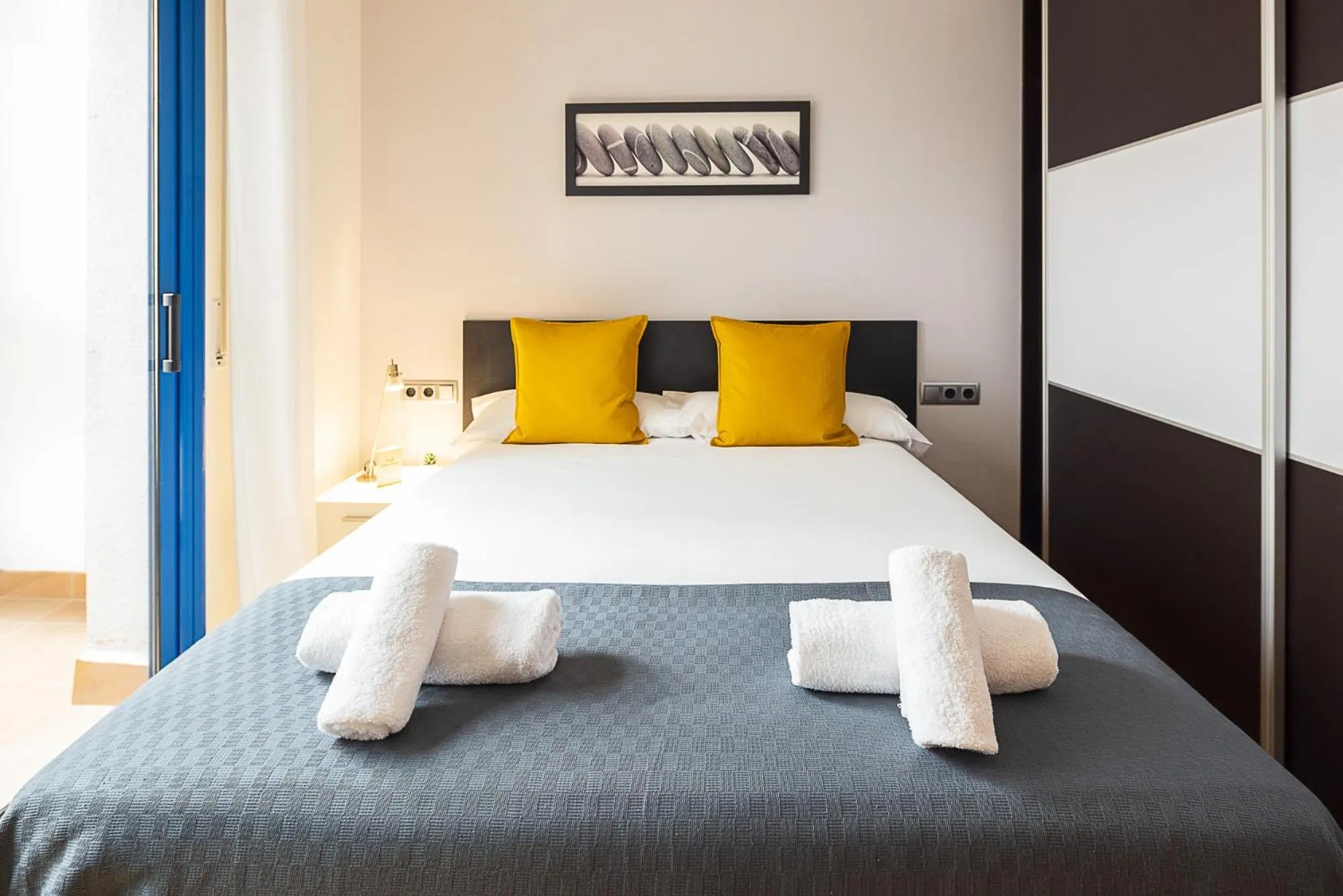 Bed in Lucas House Apartments by Sitges Group