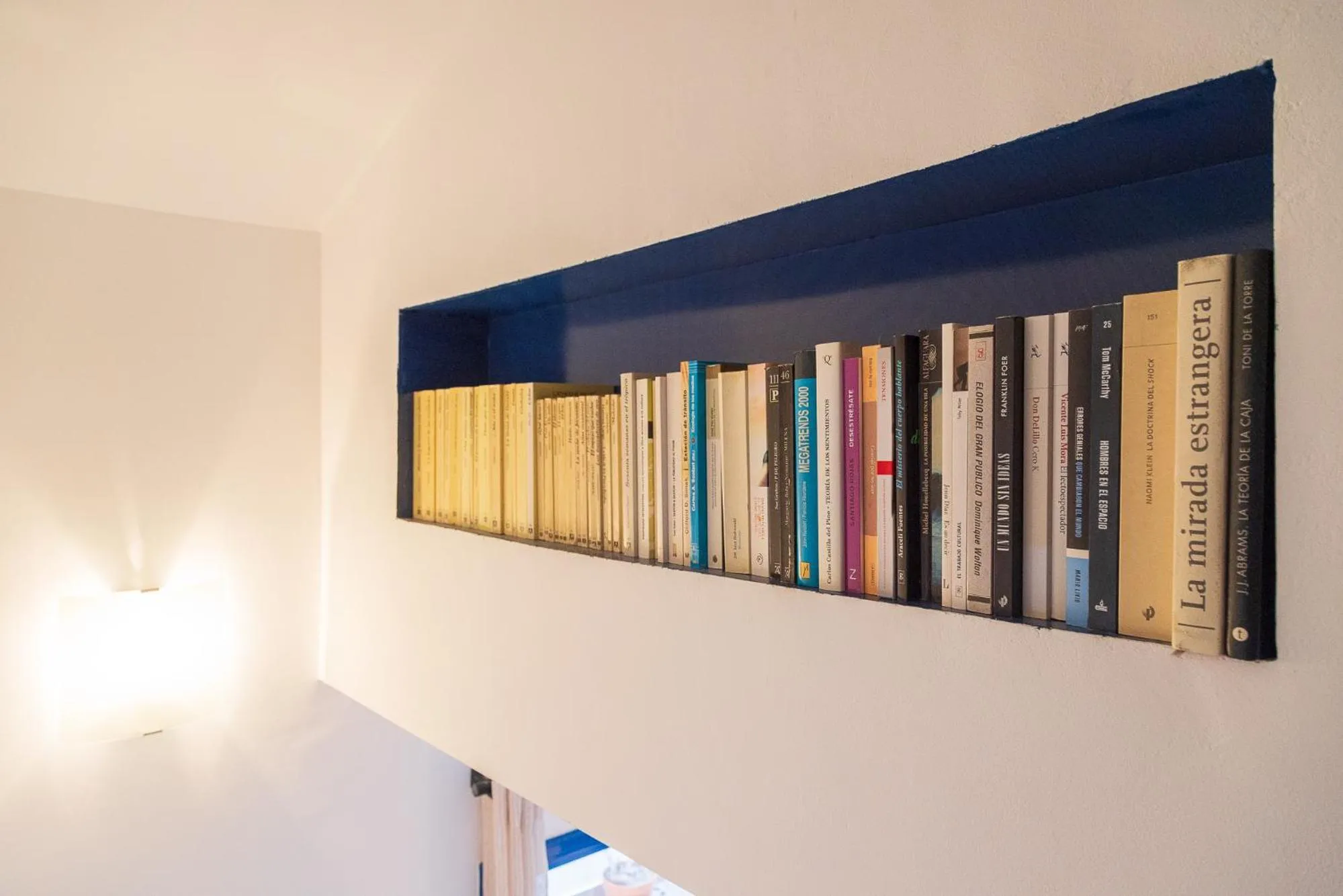 Library in Lucas House Apartments by Sitges Group