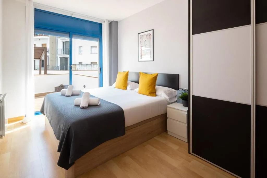 Bed in Lucas House Apartments by Sitges Group