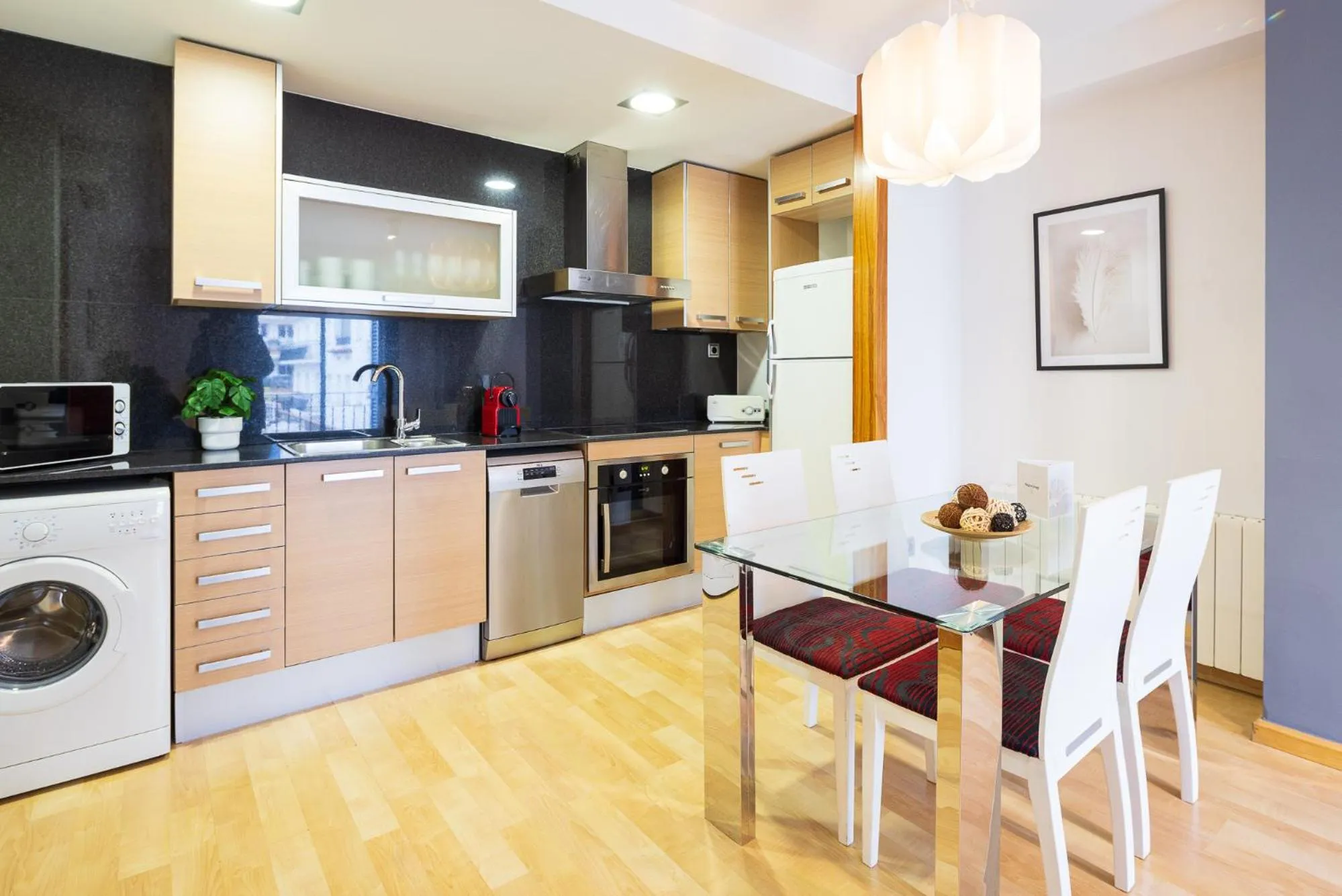 Kitchen or kitchenette in Lucas House Apartments by Sitges Group