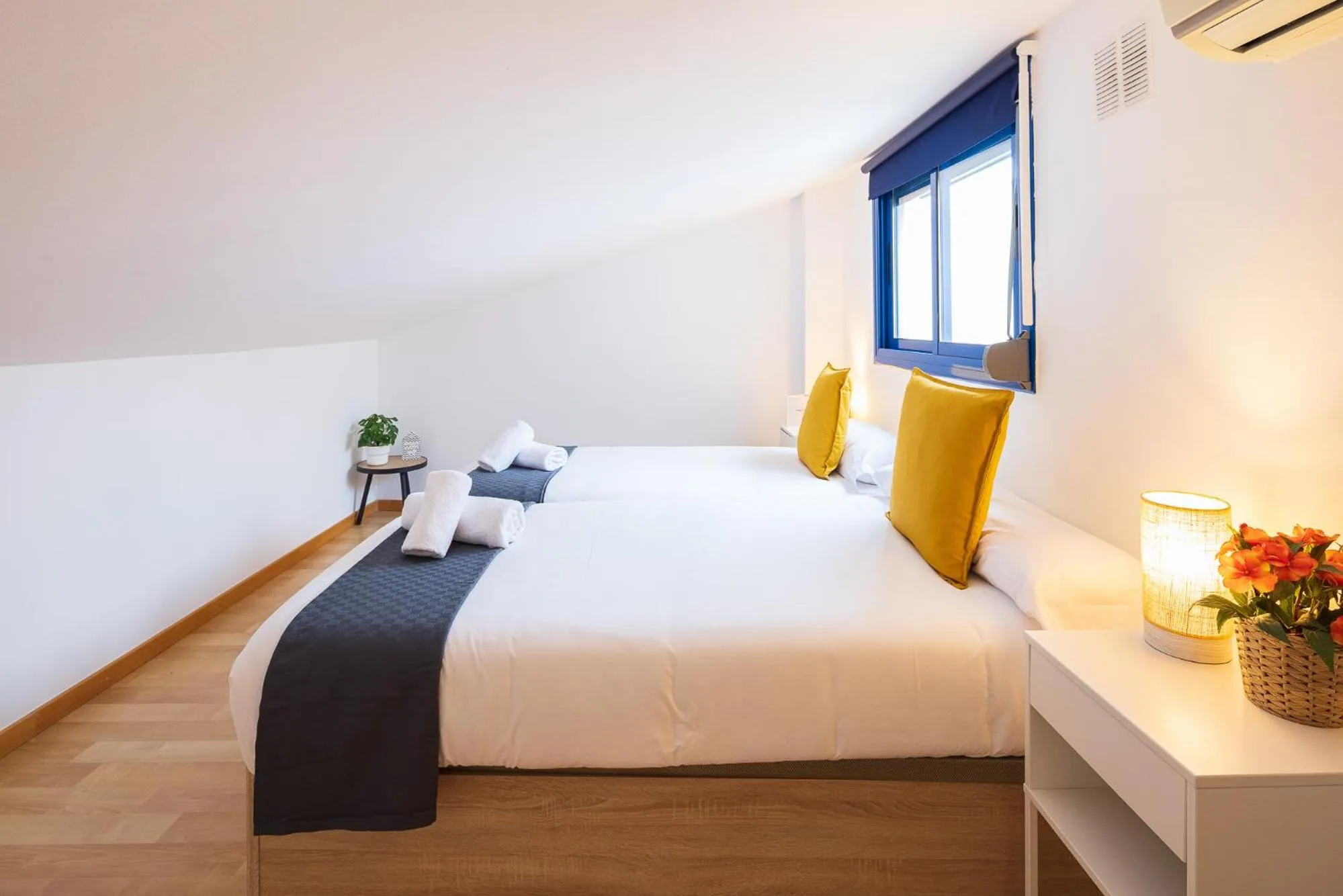 Bed in Lucas House Apartments by Sitges Group