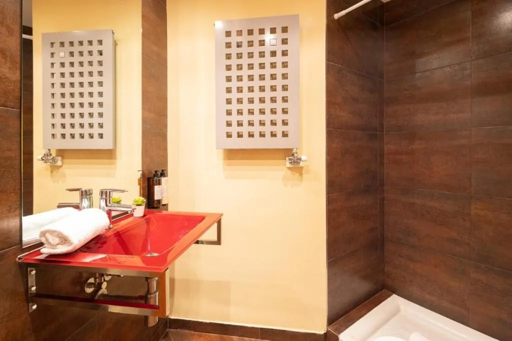 Bed in Lucas House Apartments by Sitges Group