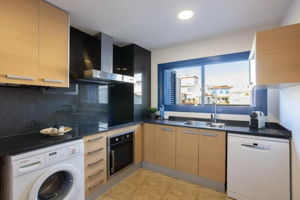 kitchen in Lucas House Apartments by Sitges Group