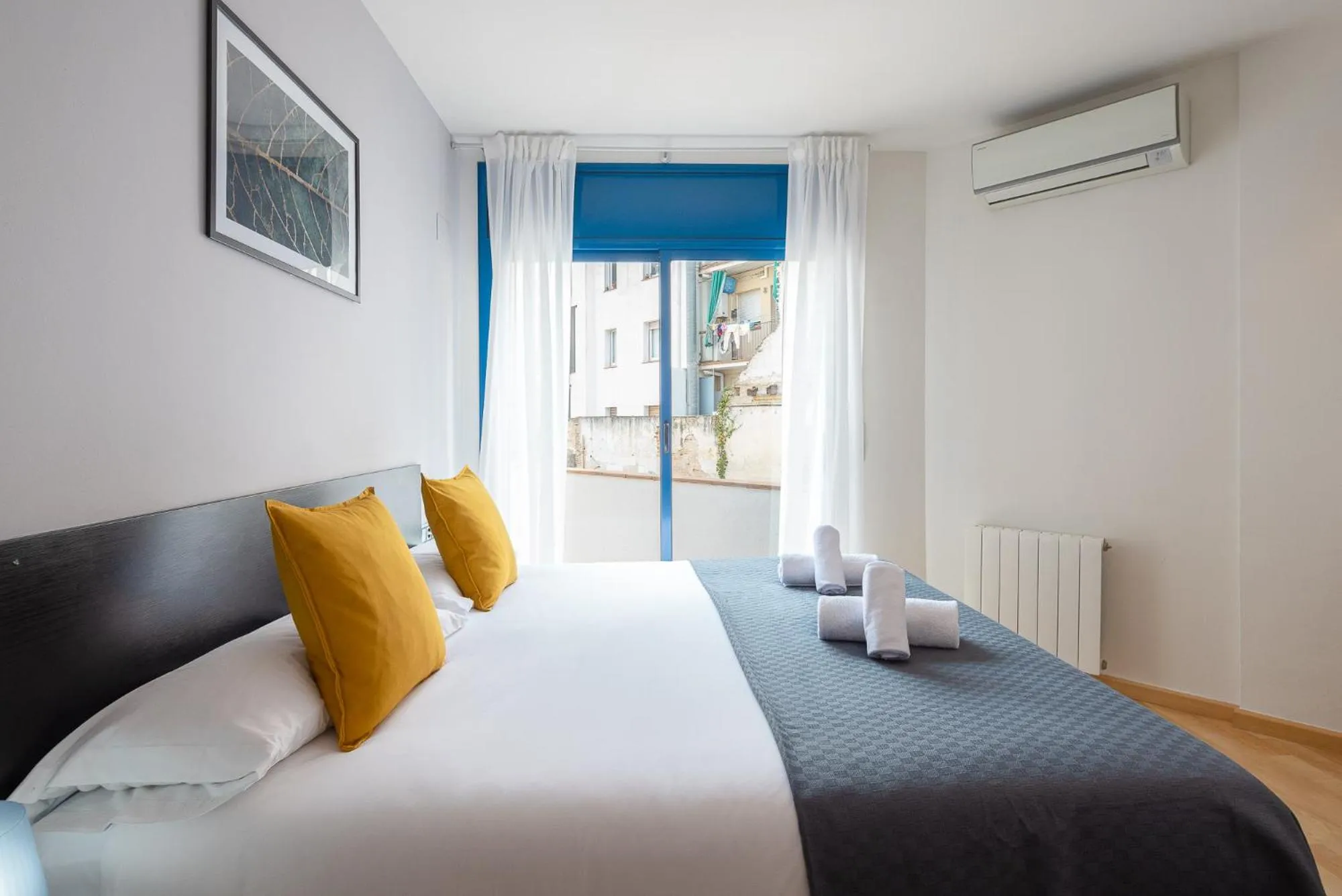 Bed in Lucas House Apartments by Sitges Group