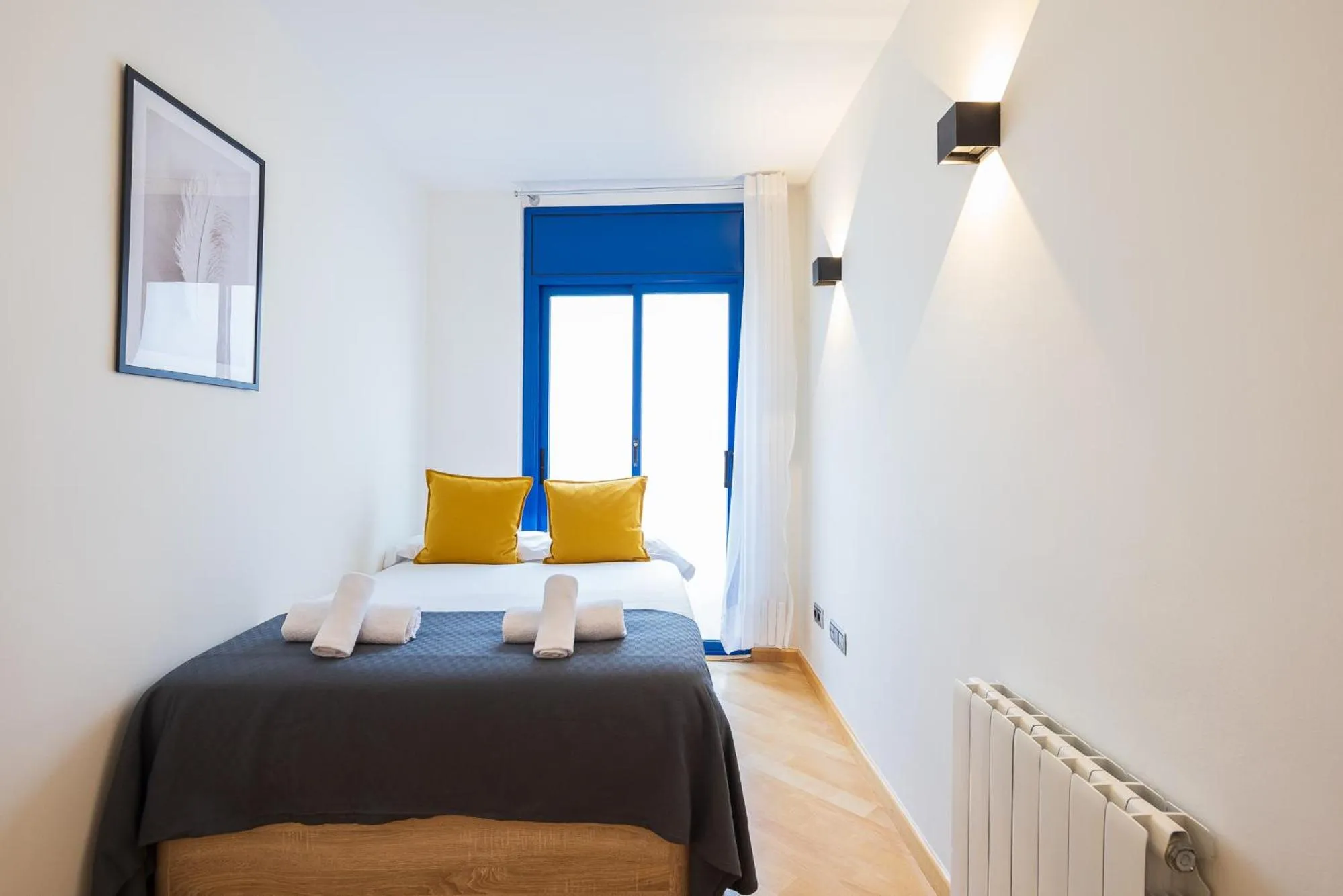 Bed in Lucas House Apartments by Sitges Group