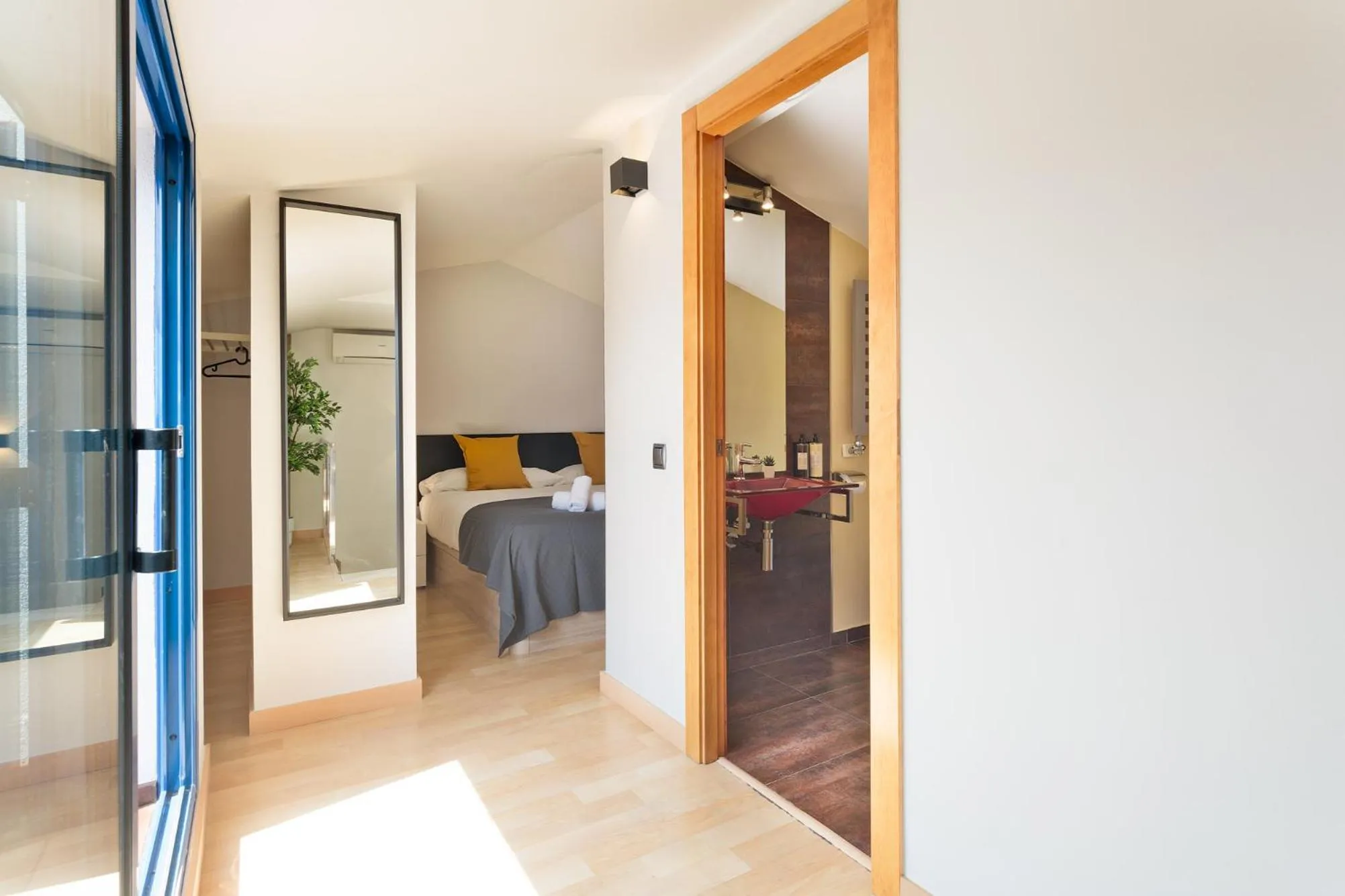 Bed in Lucas House Apartments by Sitges Group