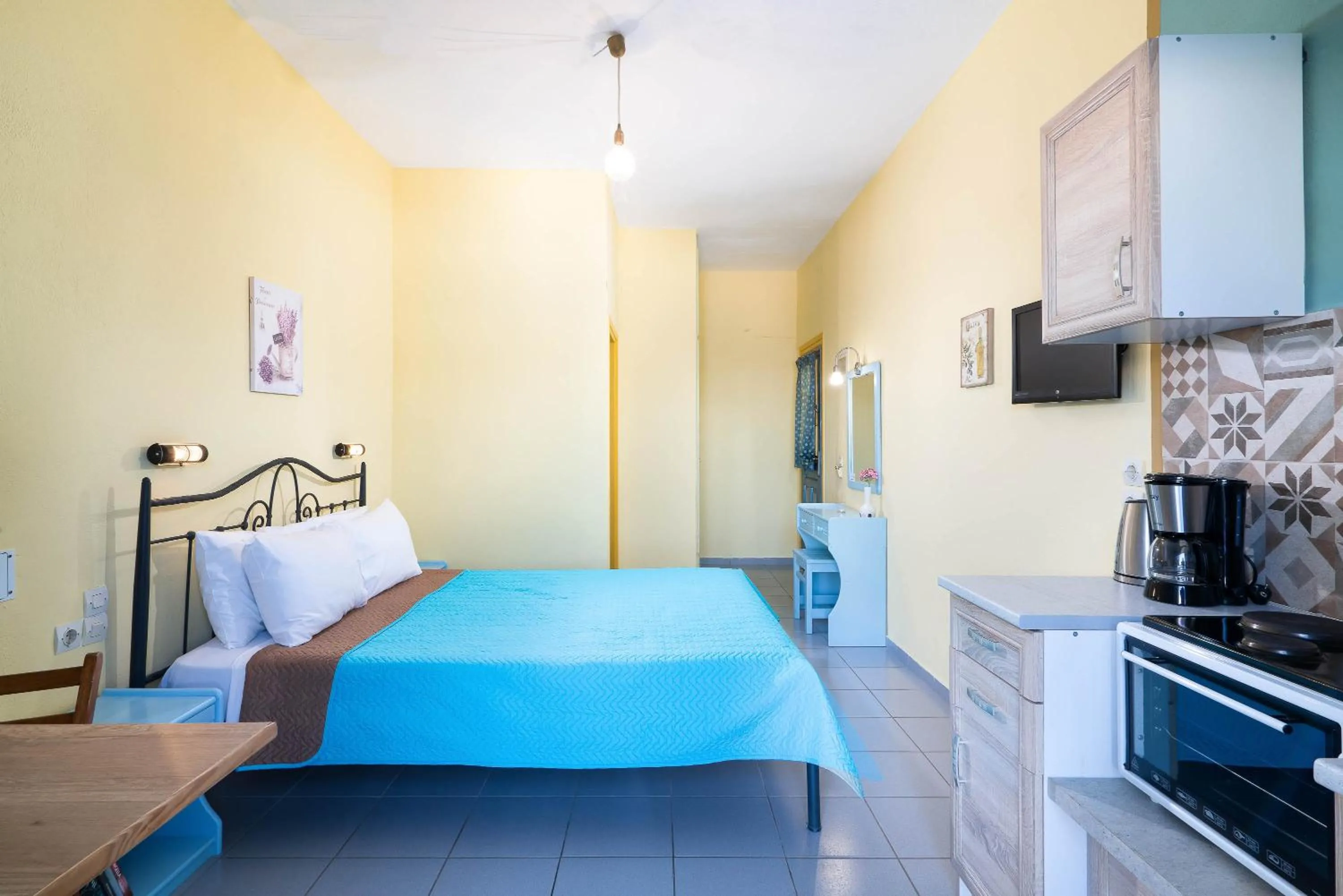 Bed in Afroditi Apartments