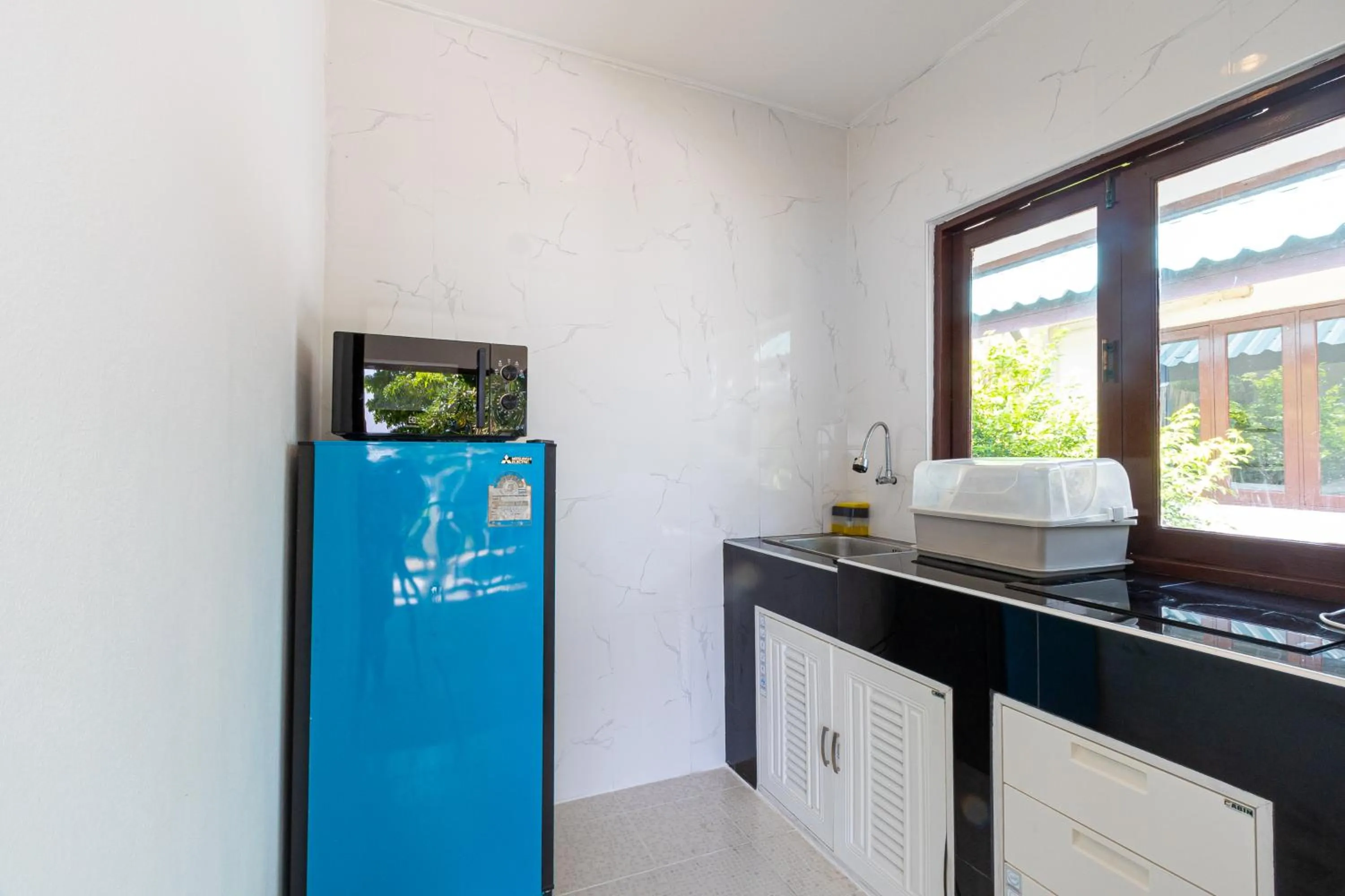 kitchen in Three Trees Samui Resort - Sarocha Villa