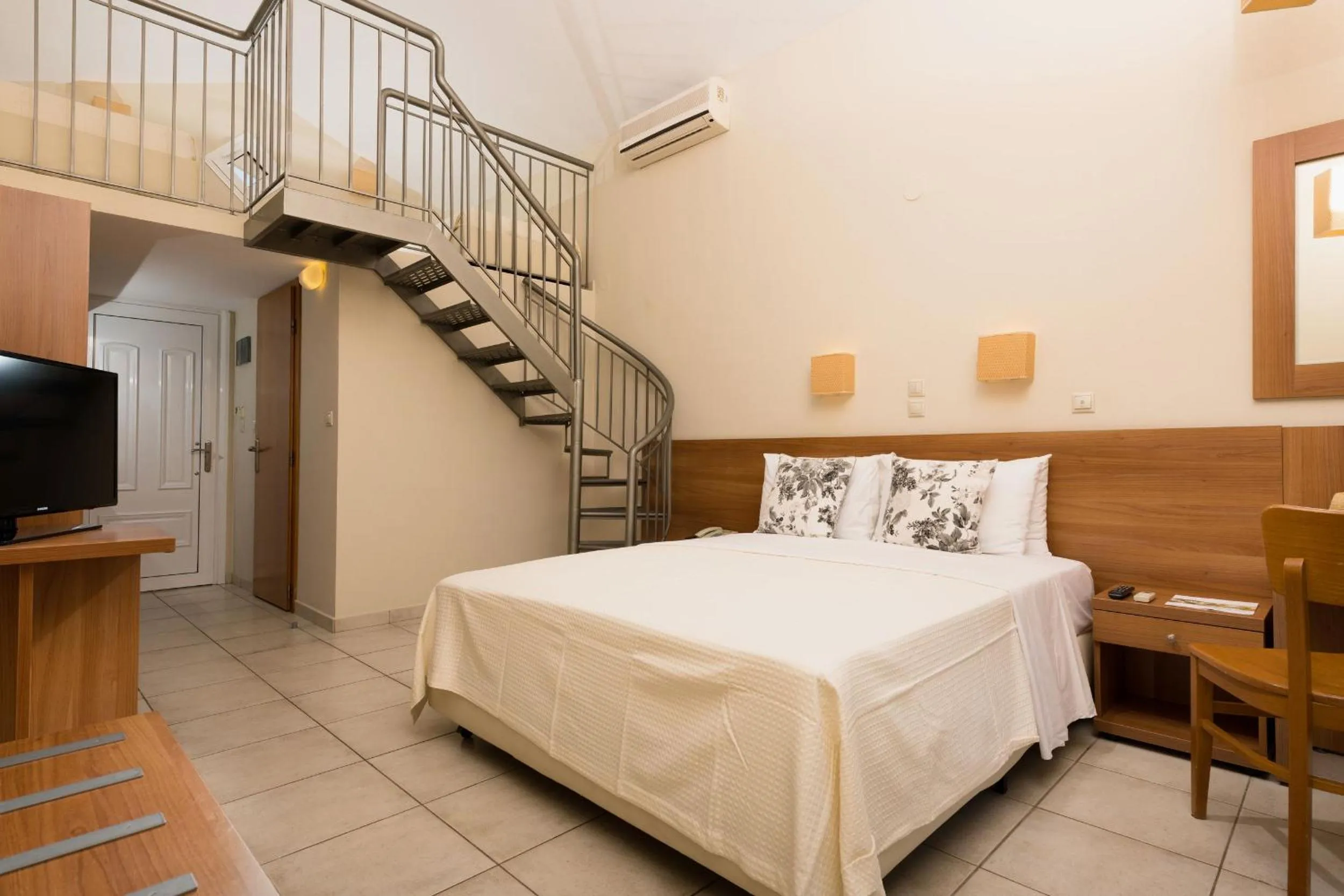 Bed in Louloudis Boutique Hotel