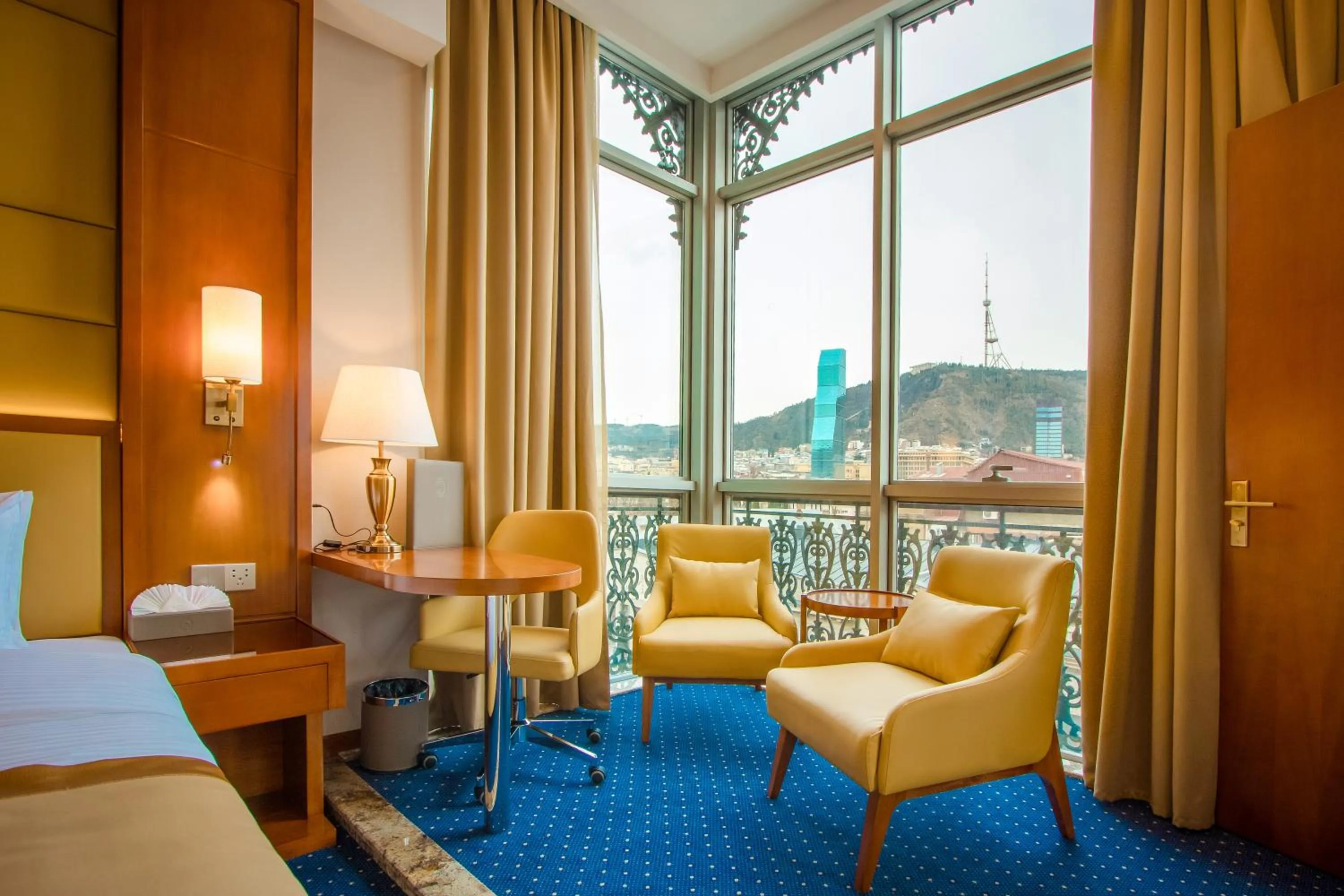 Living room, Bed in New Tiflis Hotel