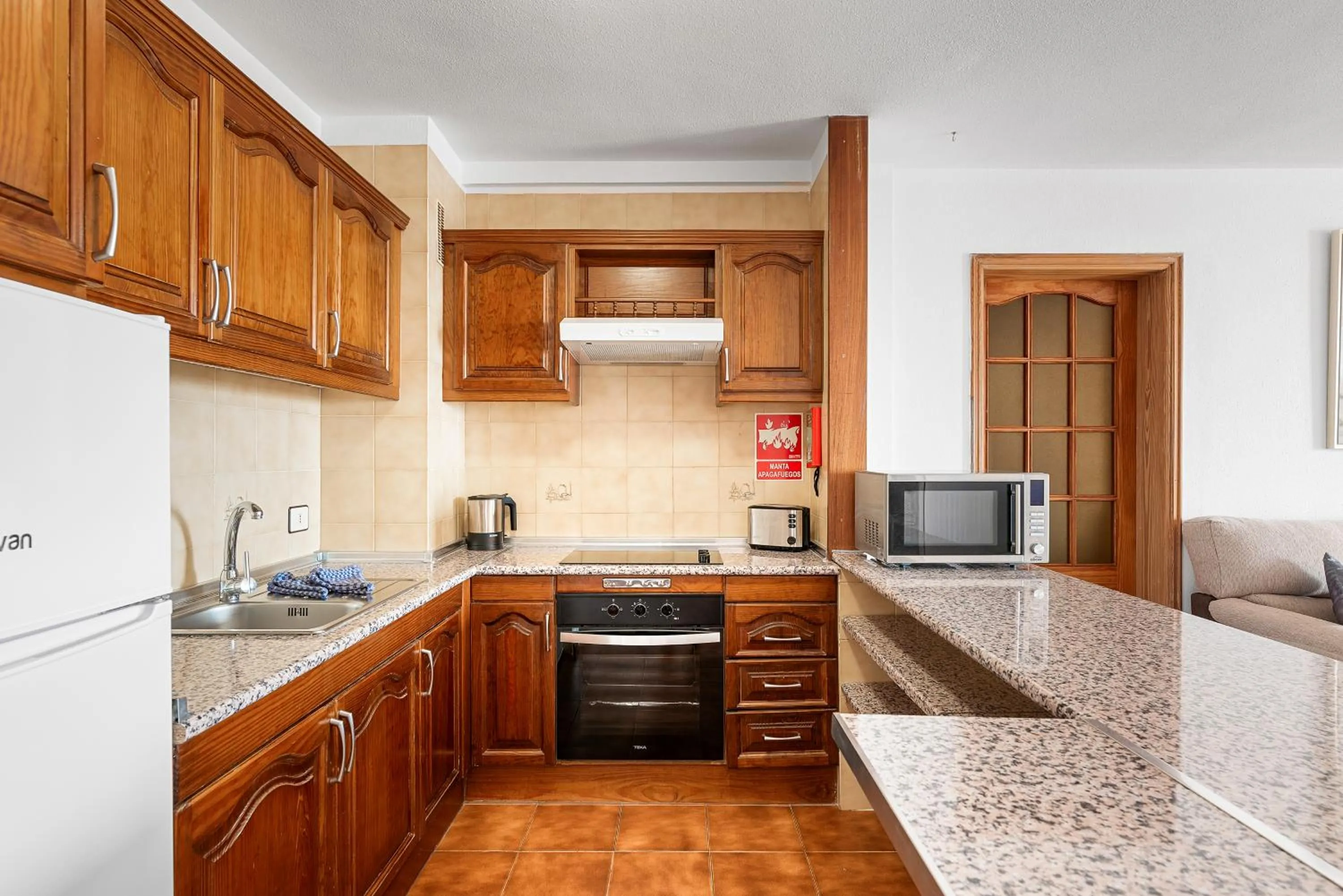 Kitchen or kitchenette in Paloma Beach Apartments