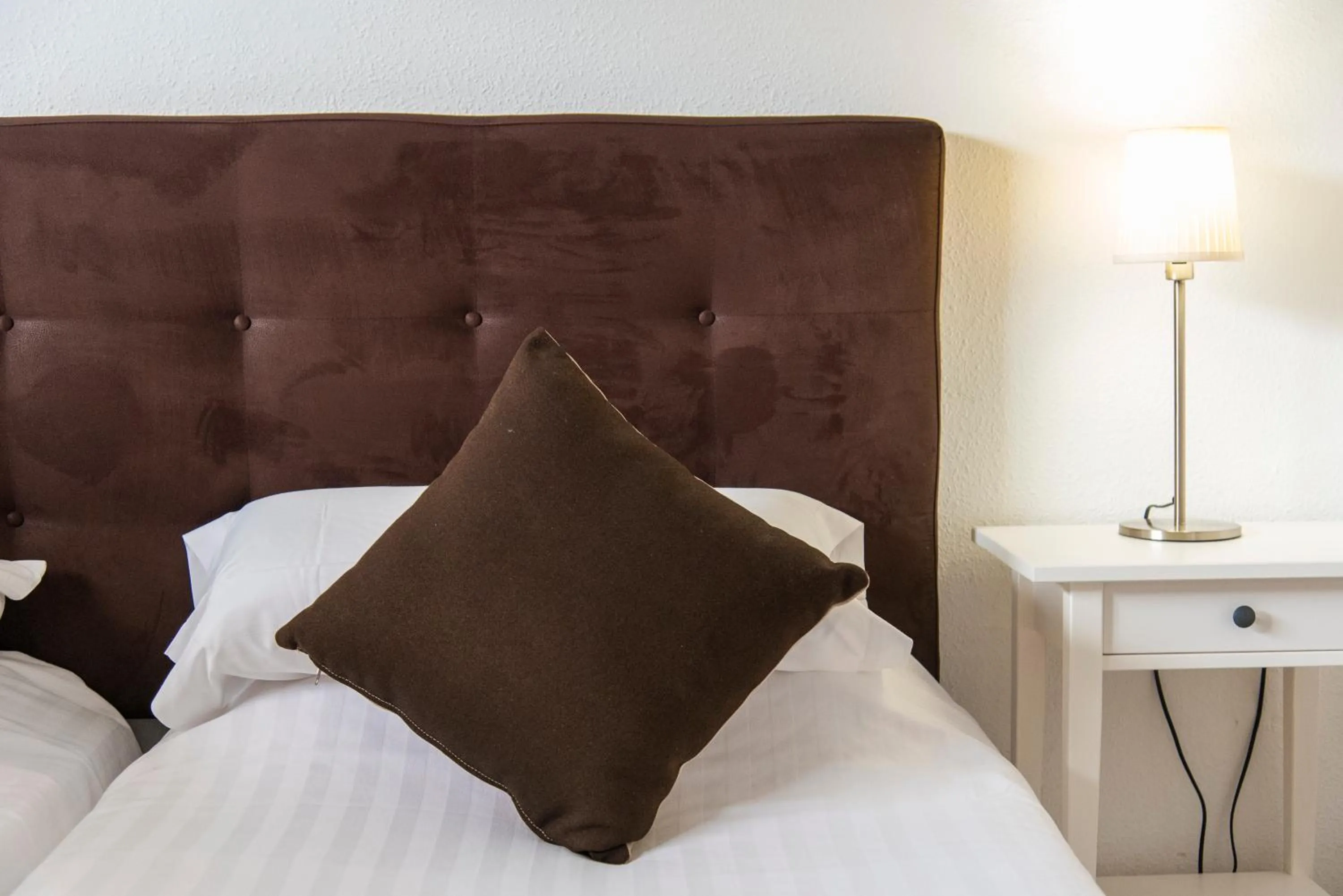 Bed in Paloma Beach Apartments