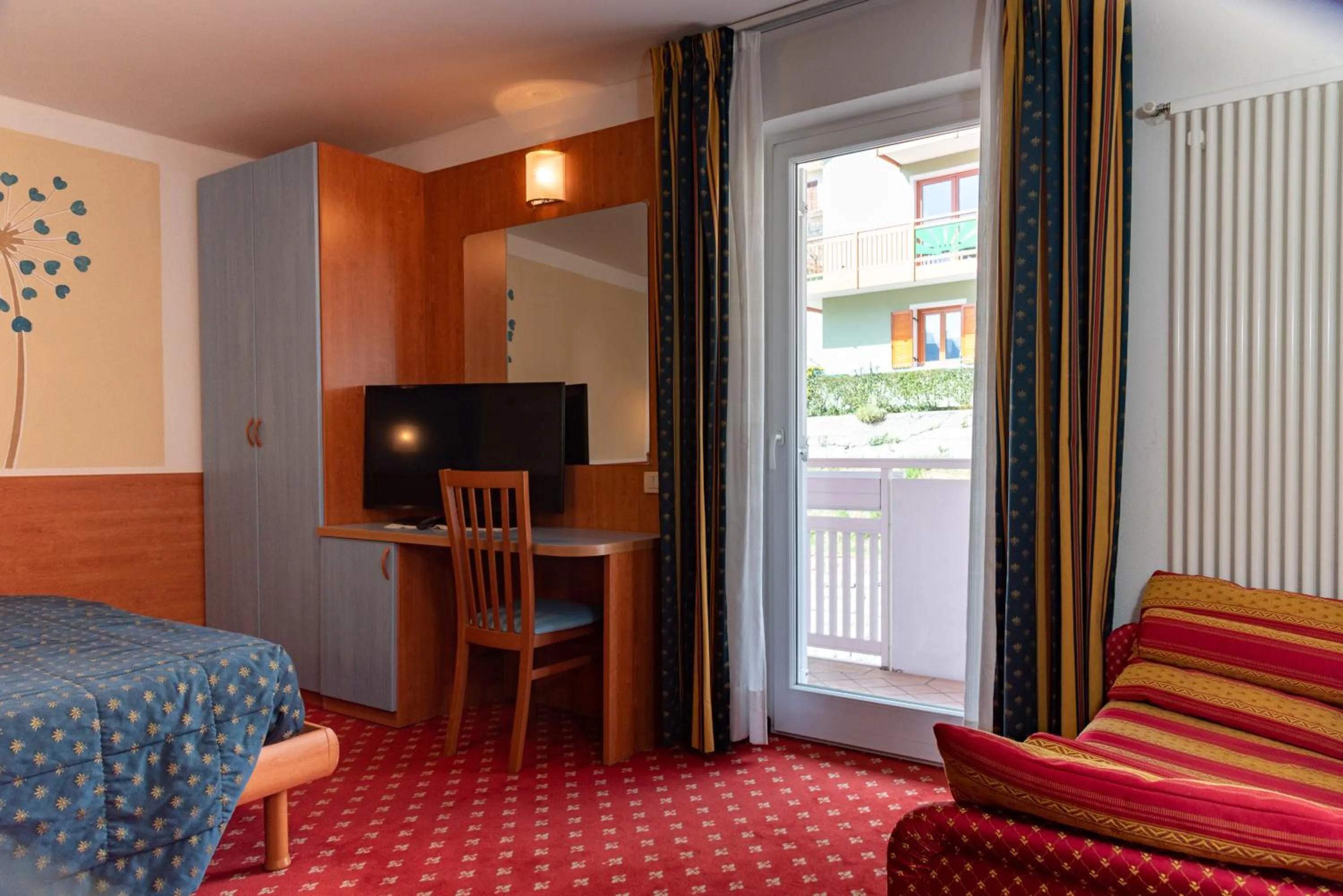 Bedroom, Bed in Hotel Londra Slow Living Molveno