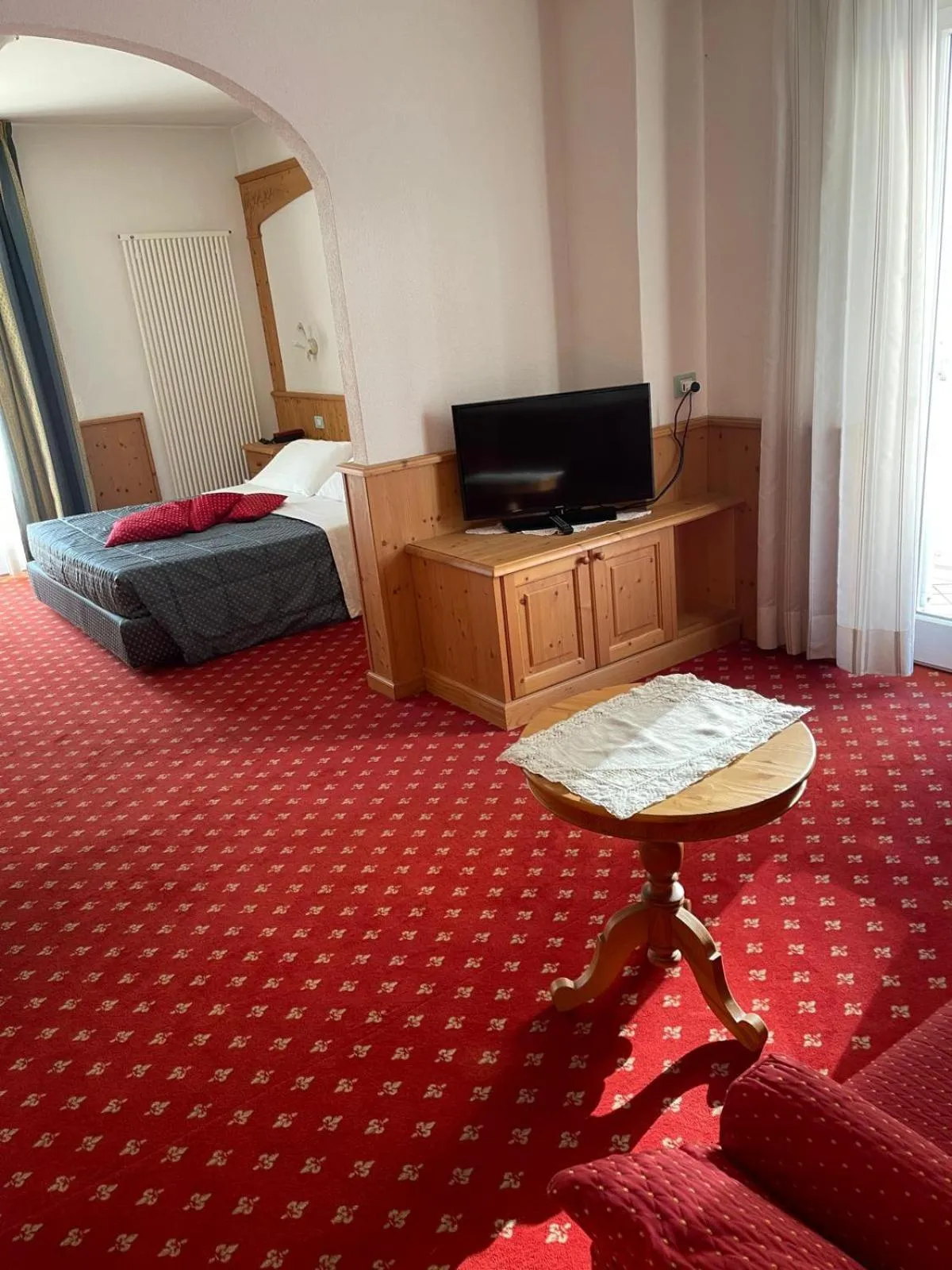 Bedroom, Bed in Hotel Londra Slow Living Molveno