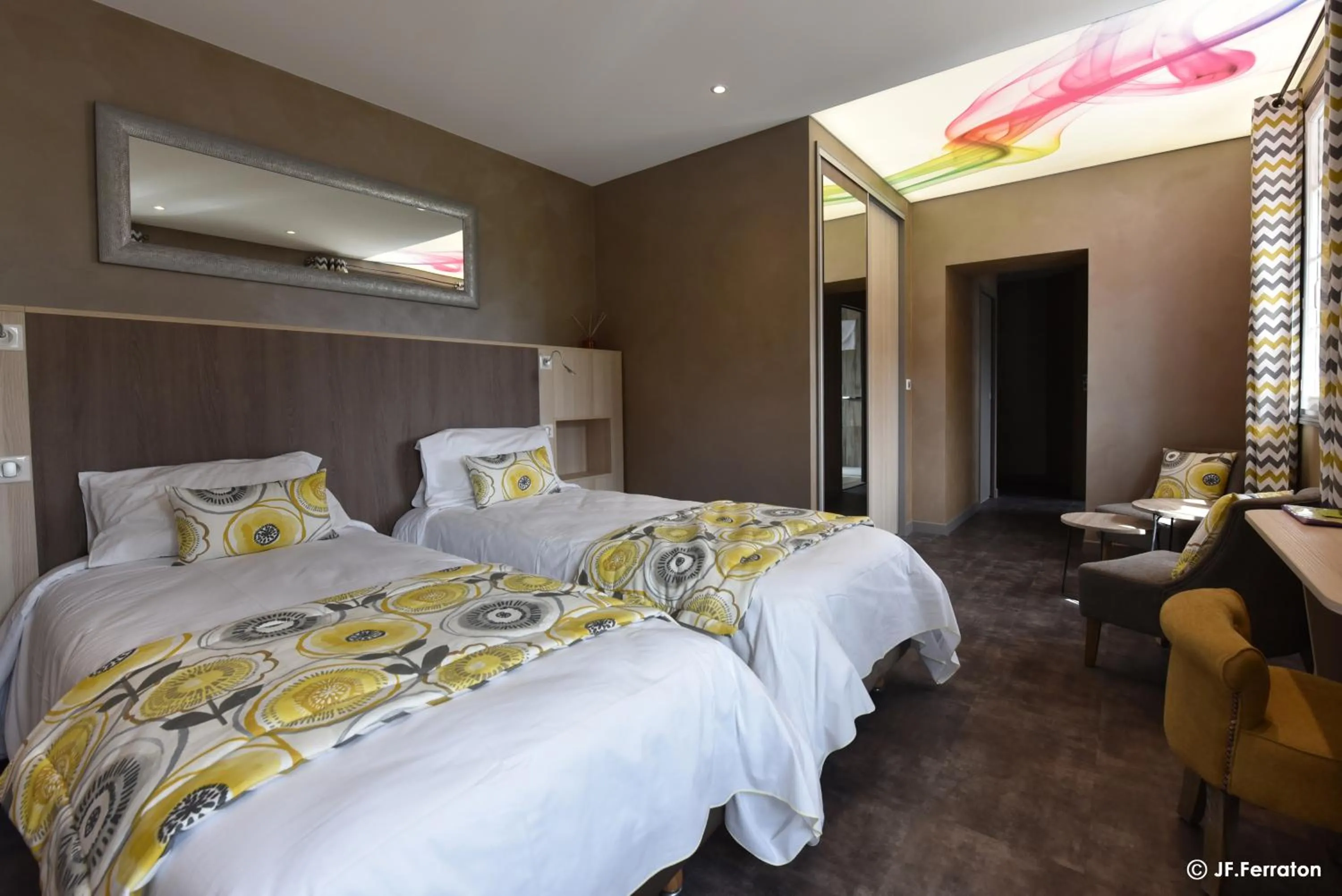 Bed in Logis Hôtel Beau Site