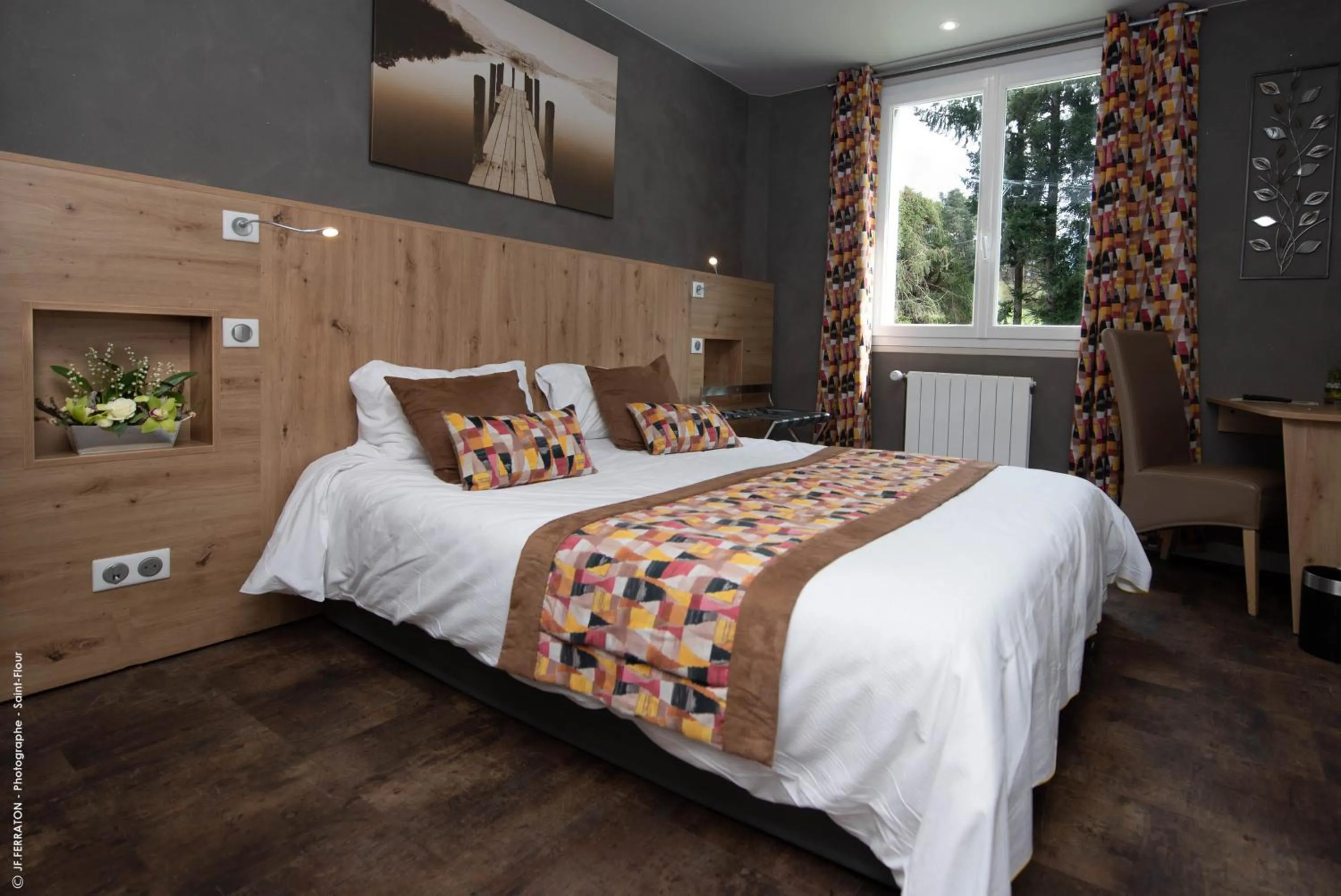 Bed in Logis Hôtel Beau Site