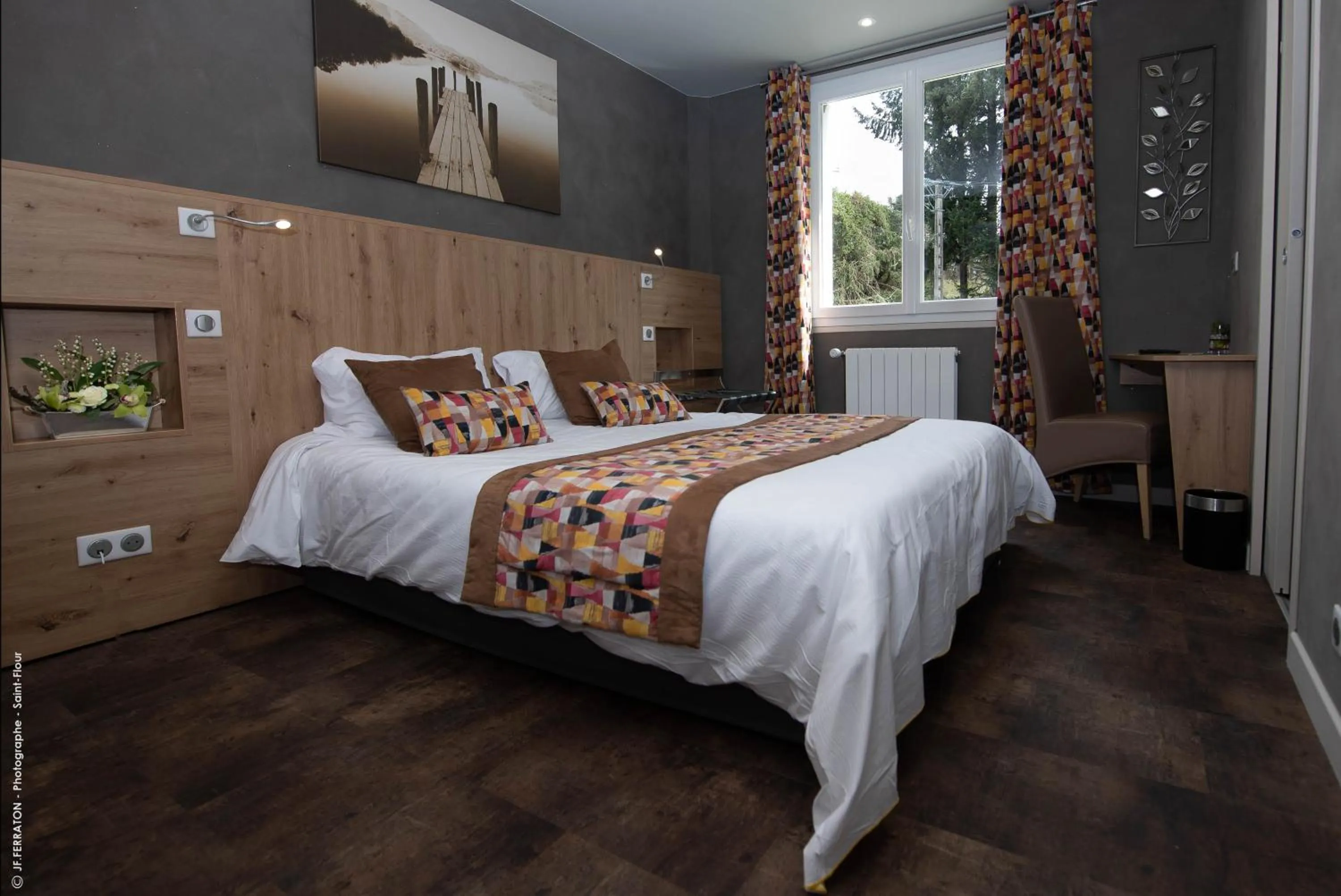 Bed in Logis Hôtel Beau Site