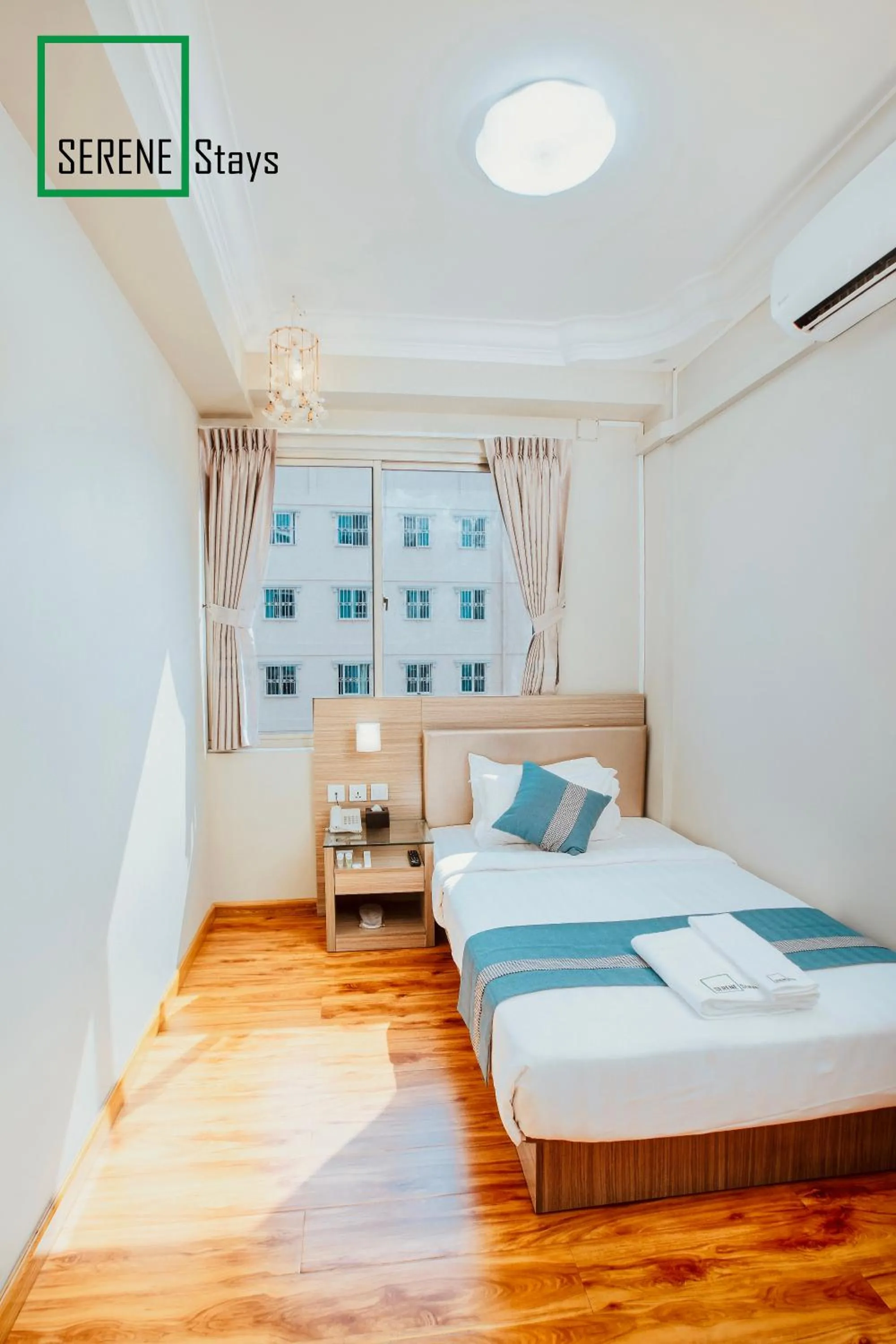 Bed in SERENE Stays Hotel